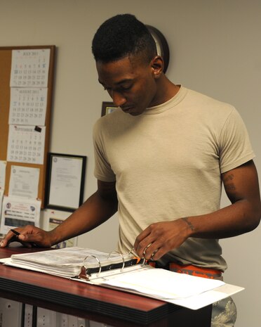 Airman Arnold Stone-Patterson prepares a pre-task safety briefing for explosive operations on Joint Base Charleston June 2. The safety briefing details all personnel responsibilities and what to do in the event of an explosive mishap. Airman Stone-Patterson is from the 437th Maintenance Squadron's Munitions Shop.  (U.S. Air Force photo/ Staff Sgt. Nicole Mickle)  