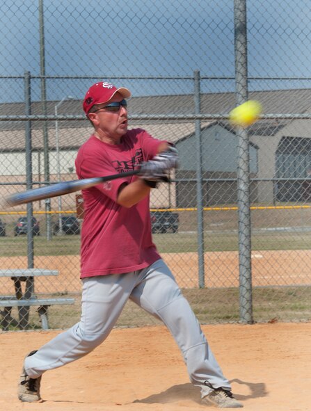 Chief Master Sgt. James Roberts, 23rd Comptroller Squadron superintendent, hits the ball during the Chiefs vs. Eagles softball game June 3, at Moody Air Force Base Ga. The Chiefs and Colonels hold this game once a year to show camaraderie. (U.S. Air Force photo/Airman 1st Class Jarrod Grammel)(RELEASED)