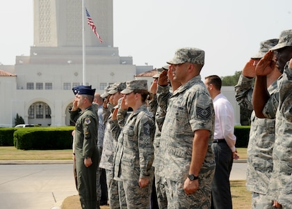 A crowd gathers as a motorcade processional transporting the remains of Army Sgt. Thomas A. Bohall, of Bel Aire, Kan., travels down Harmon Drive at Randolph Air Force Base, Texas, June 7. Bohall was assigned to the 4th Battalion, 101st Aviation Regiment, 159th Combat Aviation Brigade, 101st Airborne Division (Air Assault), Fort Campbell, Ky. Sergeant Bohall was one of six soldiers from Fort Campbell who were supporting Operation Enduring Freedom and killed by an improvised explosive device during an insurgent attack May 26, 2011 in Kandahar province, Afghanistan.  (U.S. Air Force photo/Melissa Peterson)