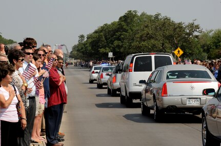 A motorcade processional transporting the remains of Army Sgt. Thomas A. Bohall, of Bel Aire, Kan., travels down Harmon Drive at Randolph Air Force Base, Texas, June 7. Bohall was assigned to the 4th Battalion, 101st Aviation Regiment, 159th Combat Aviation Brigade, 101st Airborne Division (Air Assault), Fort Campbell, Ky. Sergeant Bohall was one of six soldiers from Fort Campbell who were supporting Operation Enduring Freedom and killed by an improvised explosive device during an insurgent attack May 26, 2011 in Kandahar province, Afghanistan. (U.S. Air Force photo/Melissa Peterson)