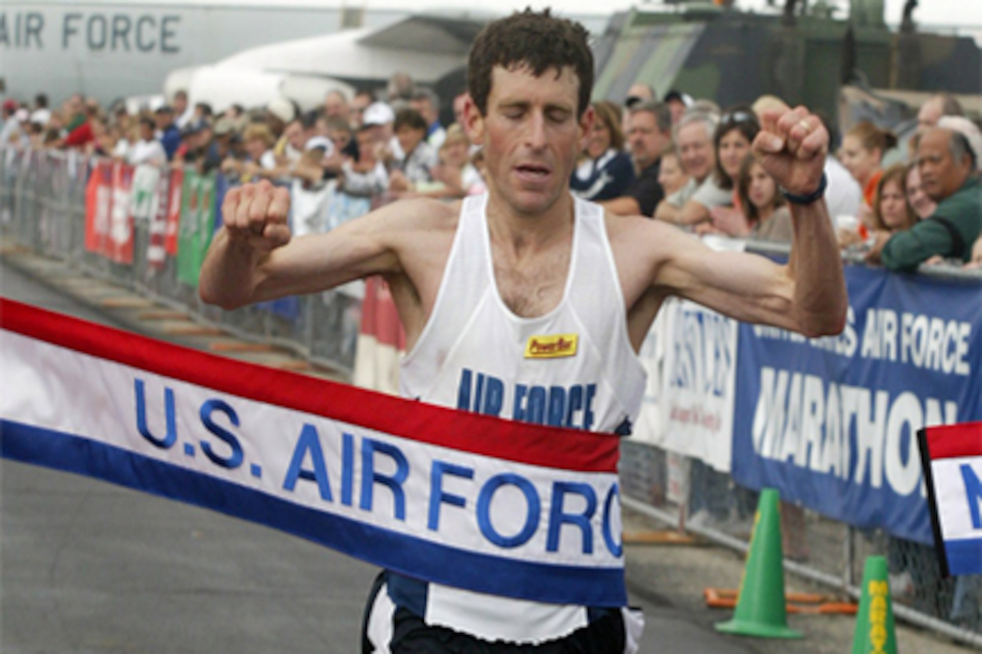 Dr. Mark Cucuzzella, winner of the 2006 Air Force Marathon, breaks through the ribbon at the race’s finish.  Dr. Cucuzzella placed in the top six in the four subsequent Air Force Marathons.  (Courtesy photo)