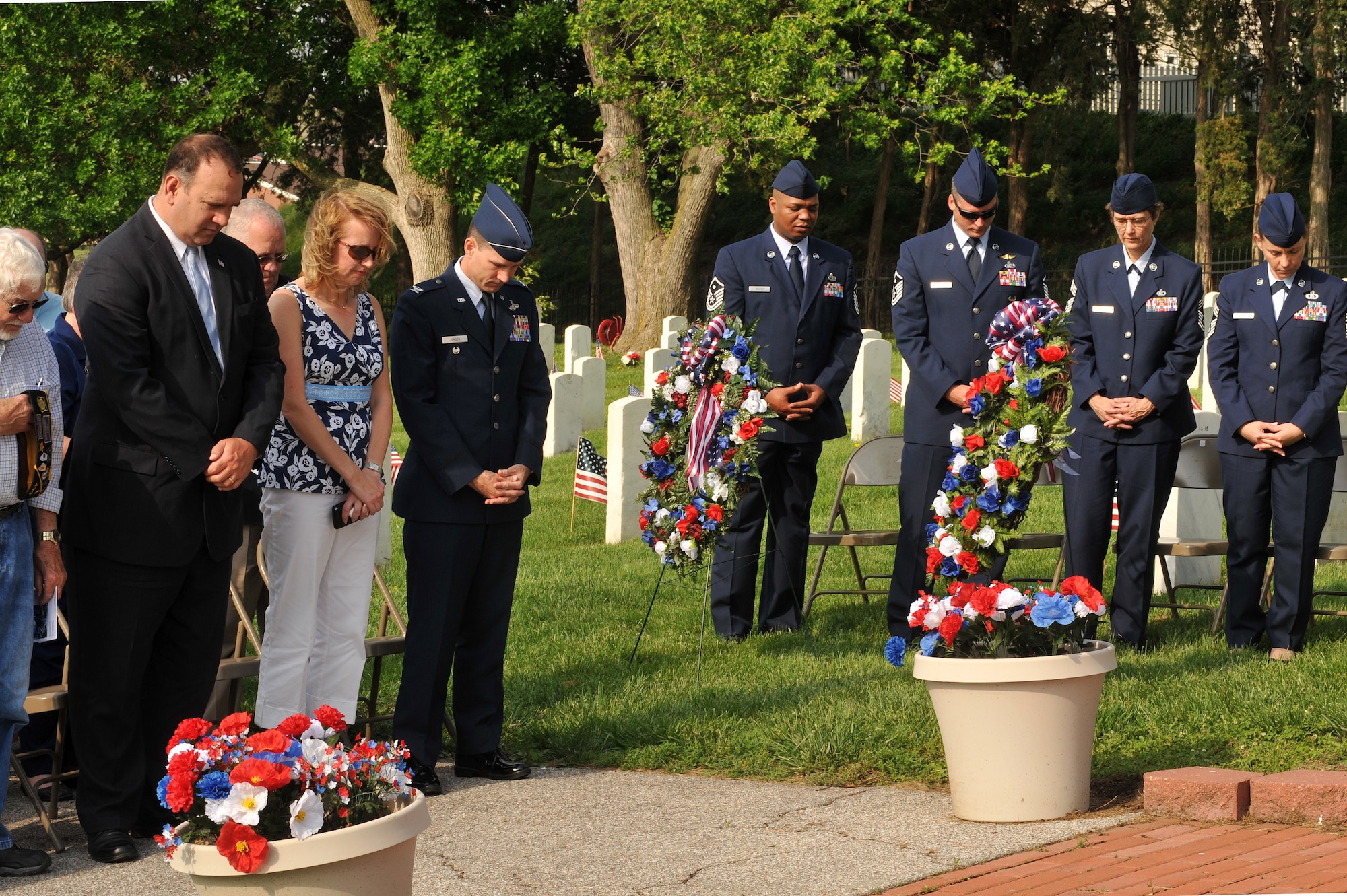 OFFUTT AIR FORCE BASE, Neb. - Members of the Offutt Air Force Base community bow their heads in prayer at the Memorial Day service is held annually to honor veterans from all eras who have served our nation. U.S. Air Force Photo by D.P. Heard
