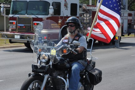 Members of the local chapter of the Patriot Guard were part of the processional transporting the remains of Army Sgt. Thomas A. Bohall, of Bel Aire, Kan., down Harmon Drive at Randolph Air Force Base, Texas, June 7. Sergeant Bohall was assigned to the 4th Battalion, 101st Aviation Regiment, 159th Combat Aviation Brigade, 101st Airborne Division (Air Assault), Fort Campbell, Ky. Sergeant Bohall was one of six soldiers from Fort Campbell who were supporting Operation Enduring Freedom and killed by an improvised explosive device during an insurgent attack May 26, 2011 in Kandahar province, Afghanistan. (U.S. Air Force photo/Rich McFadden) (released)