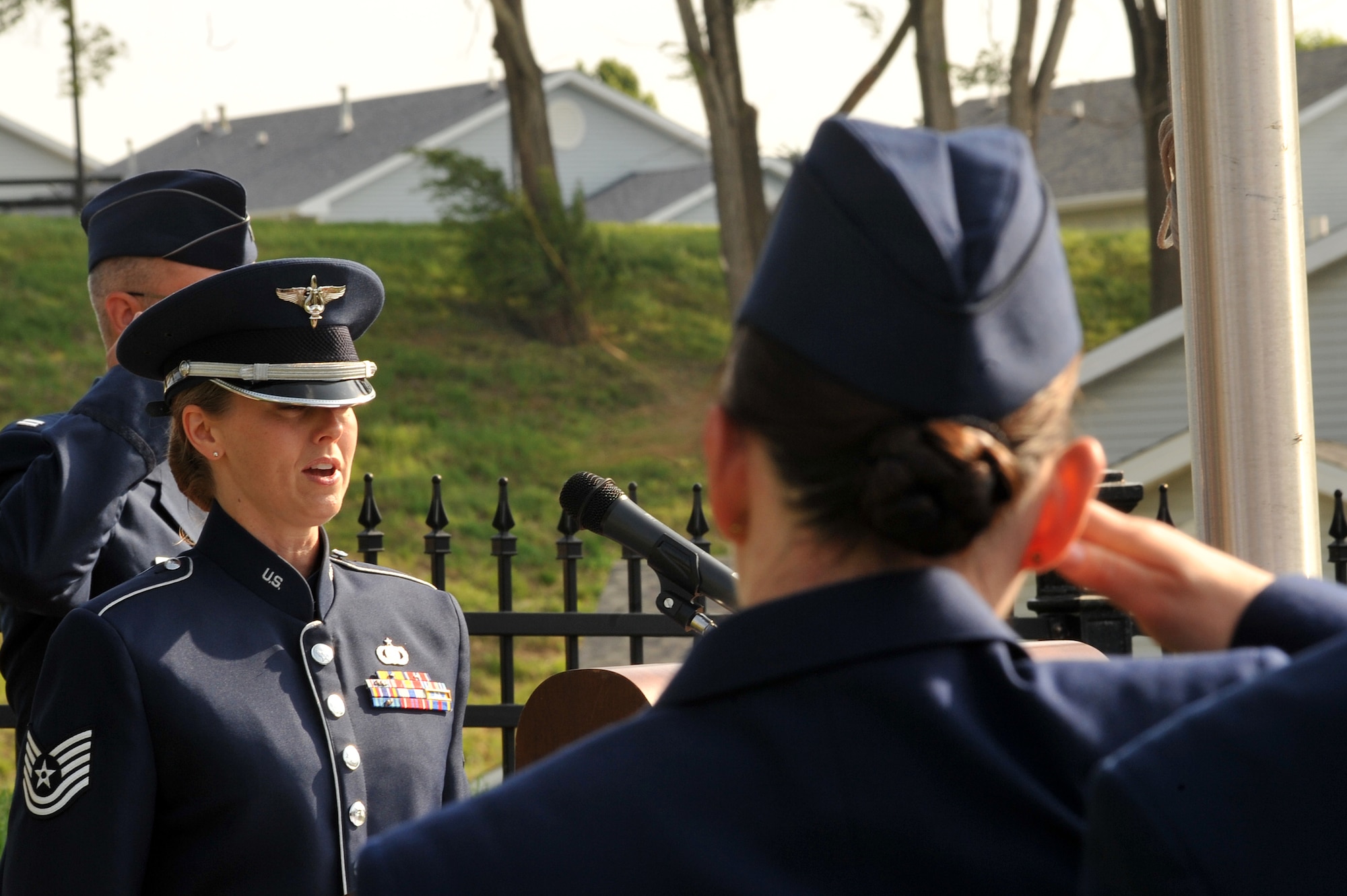 OFFUTT AIR FORCE BASE, Neb. - Tech.Sgt. Krista Joyce of the Heartland of America Band sings national anthem at the annual Memorial Day service at the Offutt Air Force Base cemetery May 30th.  The Memorial Day service is held annually to honor veterans from all eras who have served our nation. U.S. Air Force Photo by D.P. Heard
