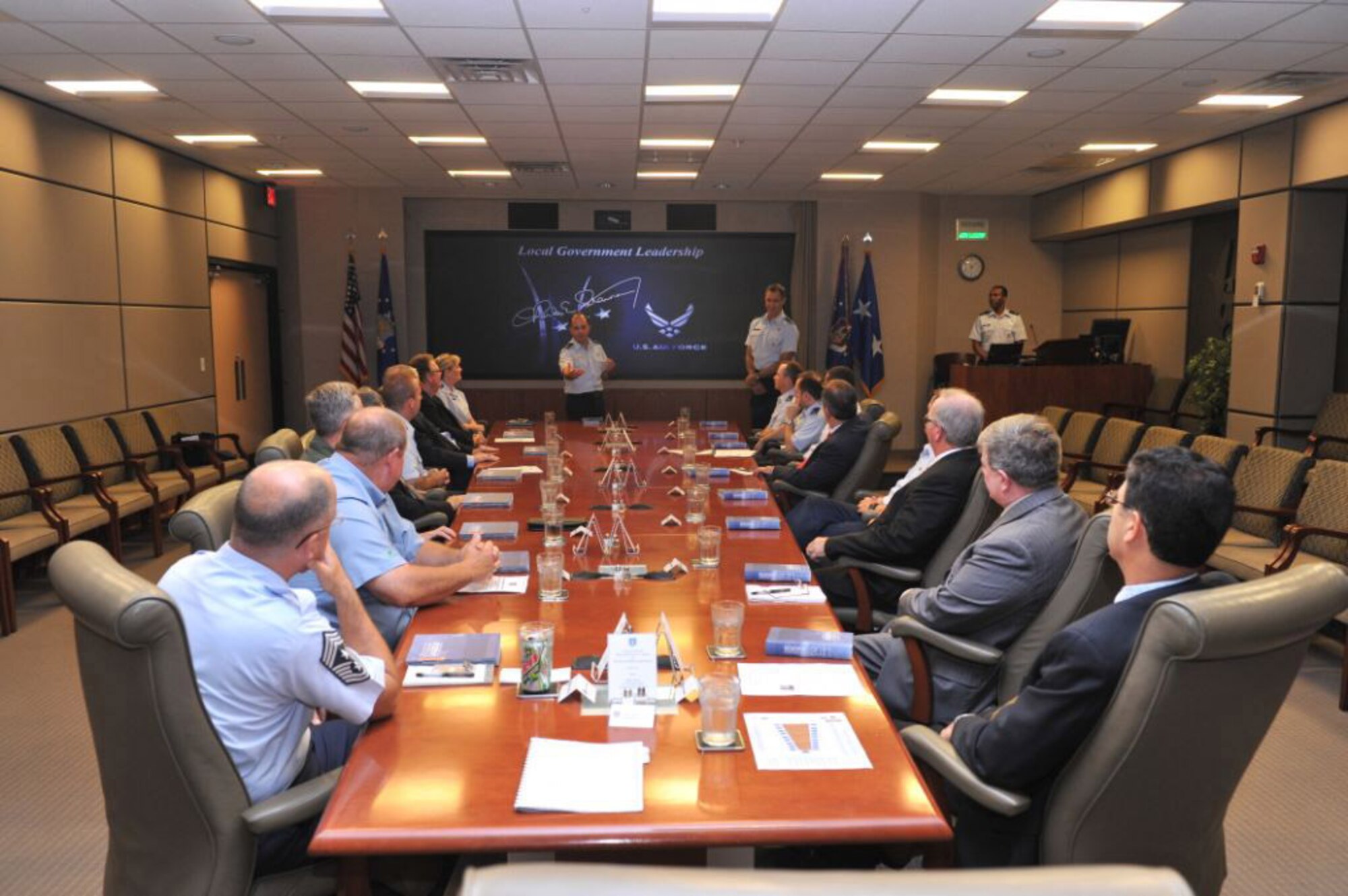 Maj. Don Schofield, commander of the Band of the U.S. Air Force Reserve, speaks to Middle Georgia mayors about the band during a luncheon June 3, 2011, at Headquarters Air Force Reserve Command, Robins Air Force Base, Ga. Maj. Gen. Craig Gourley, AFRC vice commander, hosted Warner Robins Mayor Chuck Shaheen, Perry Mayor Jimmy Faircloth, Dublin Mayor Phil Best Jr., Macon Mayor Robert Reichert, Centerville Mayor John Harley and Fort Valley Mayor John Stumbo at the headquarters. The mayors learned about the Air Force Reserve mission, contribution and impact on the local communities. (U.S. Air Force photo/Gary Cutrell)