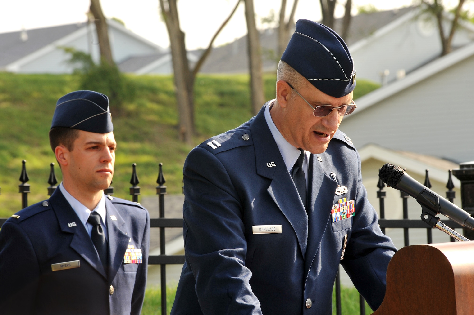 OFFUTT AIR FORCE BASE, Neb. - Capt. Robert Duplease, 55th Wing, welcomes guests to the annual Offutt Air Force Base Memorial Day service at the Offutt cemetery May 30th.  2nd Lt. Jamie P. Myers, behind him, also of the 55th Wing accompanies him. The Memorial Day service is held annually to honor veterans from all eras who have served our nation. U.S. Air Force Photo by D.P. Heard
