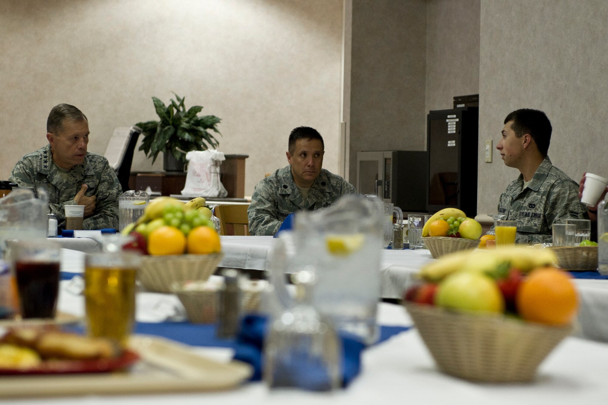 HOLLOMAN AIR FORCE BASE, N.M. -- Gen. William M. Fraser III, commander of Air Combat Command, speaks with Airman 1st Class Kevin Kilgore, 49th Material Maintenance Squadron June 2, 2011 at Shifting Sands dining facility. General Fraser answered questions on Airmen’s minds during breakfast at the dining facility. (U.S. Air Force photo by Airman 1st Class Joshua Turner/Released)