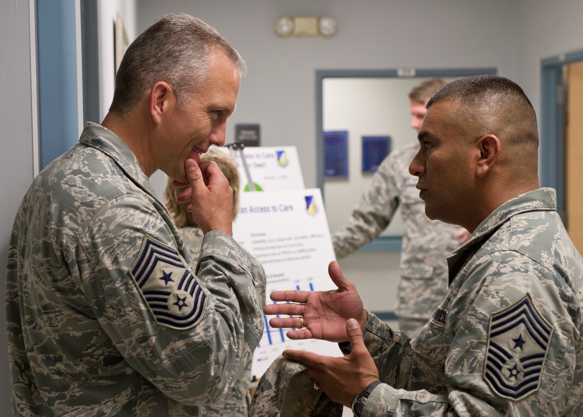 HOLLOMAN AIR FORCE BASE, N.M. -- Chief Master Sgt. Martin Klukas, command chief of Air Combat Command, speaks with Chief Master Sgt. Gerardo Tapia, 49th Wing command chief, June 1, 2011, at the 49th Medical Group. Chief Klukas accompanied Gen. William M. Fraser III, commander of ACC, during a tour of various agencies. (U.S. Air Force photo by Airman 1st Class Joshua Turner/Released)
