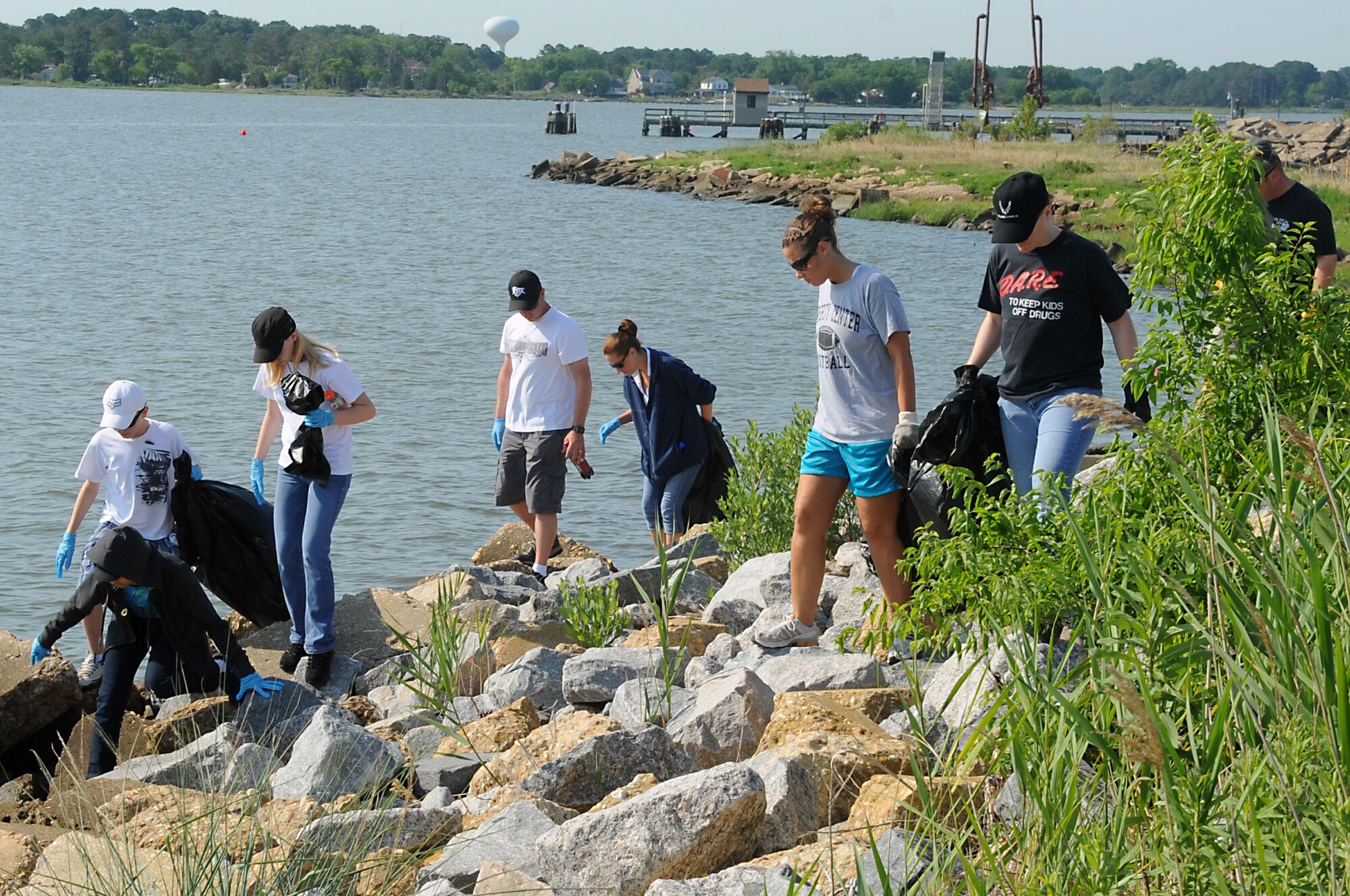 Volunteers participate in the 23rd Annual Clean the Bay 2011 at Langley Air Force Base, Va., June 4, 2011. More than 260 volunteers cleaned debris from the base shoreline and waterways to keep them clean and safe. (U.S. Air Force photo by Airman 1st Class Kayla Newman/Released)