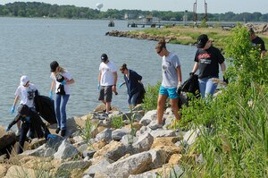 Volunteers participate in the 23rd Annual Clean the Bay 2011 at Langley Air Force Base, Va., June 4, 2011. More than 260 volunteers cleaned debris from the base shoreline and waterways to keep them clean and safe. (U.S. Air Force photo by Airman 1st Class Kayla Newman/Released)