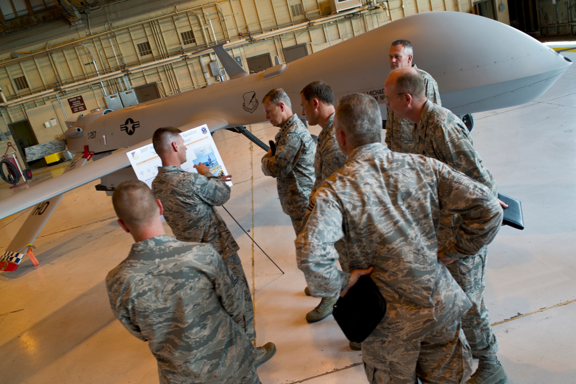HOLLOMAN AIR FORCE BASE, N.M. -- Holloman leadership show Gen. William M. Fraser III, commander of Air Combat Command commander, an MQ-1 Predator, June 1, 2011, during his visit to the base. The 49th Wing explained the aircraft’s capabilities to General Fraser as well as the transition from contract maintenance to Air Force maintenance. (U.S. Air Force photo by Airman 1st Class Joshua Turner/Released)
