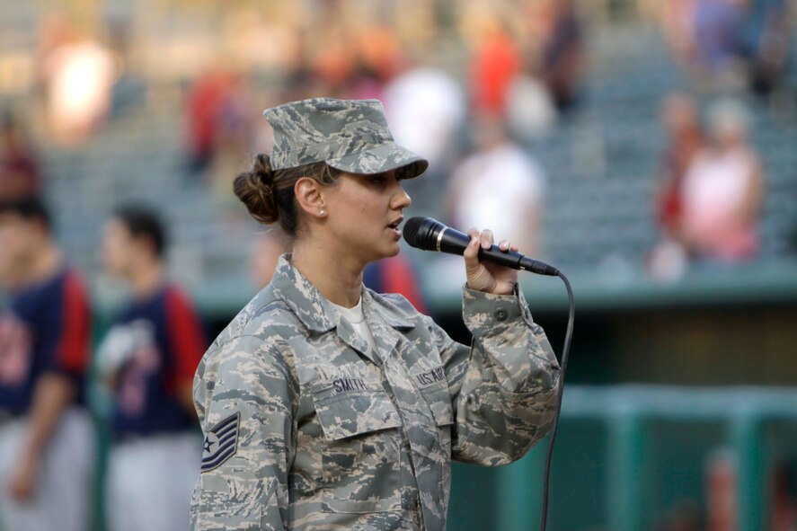 Tech. Sgt. Chandra Smith, a member of the 162nd Fighter Wing and former member of the Air Force’s Tops in Blue performance team, sings the National Anthem at Kino Memorial Stadium for the Tucson Padres’ June 5 Air Guard appreciation day game. (U.S. Air Force photo/Tech. Sgt. Hollie Hansen)