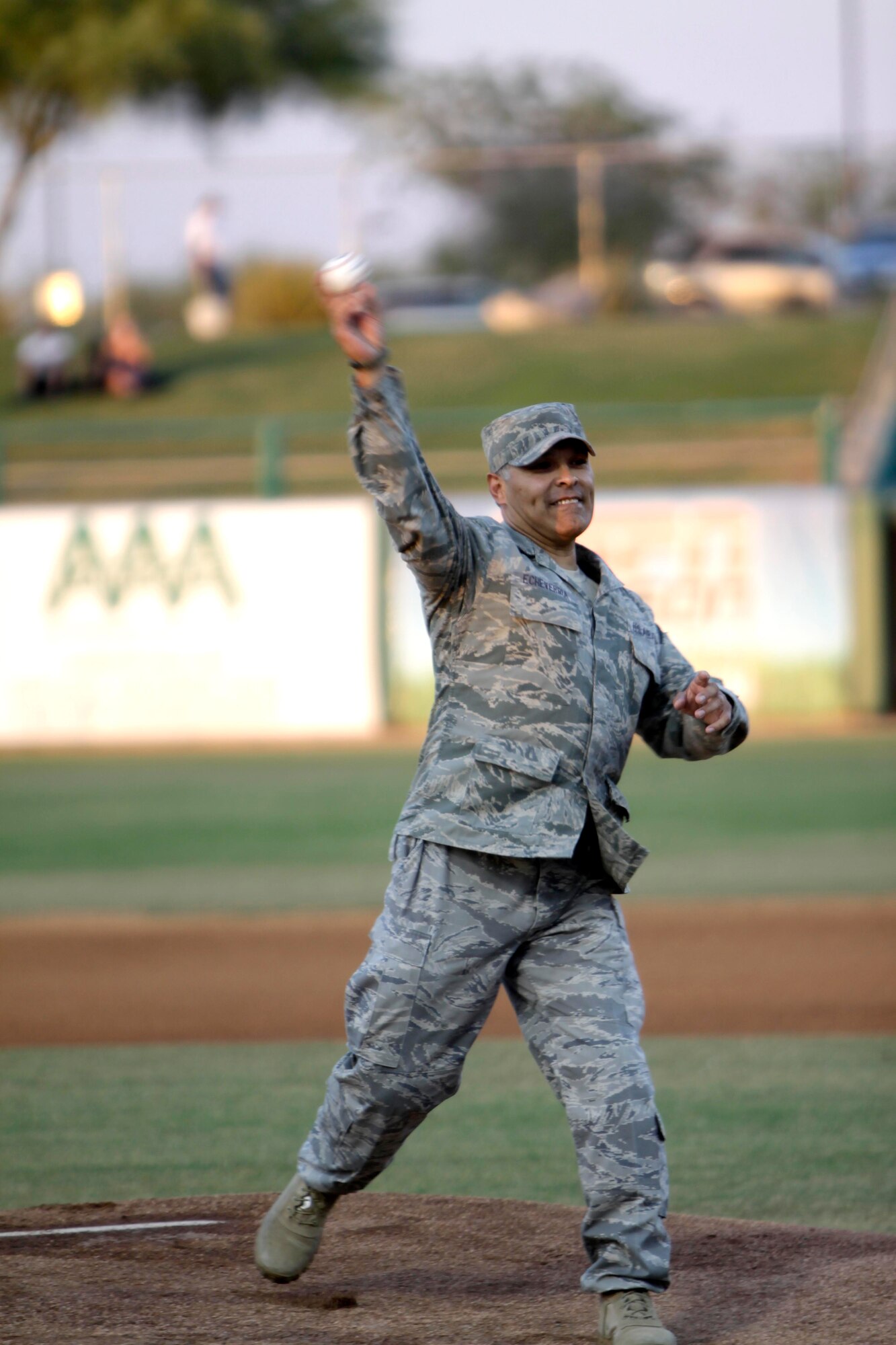 Tech. Sgt. Manny Echeverria, a four-time veteran of Operation Iraqi Freedom and two-time veteran of Operation Enduring Freedom, throws out a first pitch at Kino Memorial Stadium June 5. (U.S. Air Force photo/Tech. Sgt. Hollie Hansen)