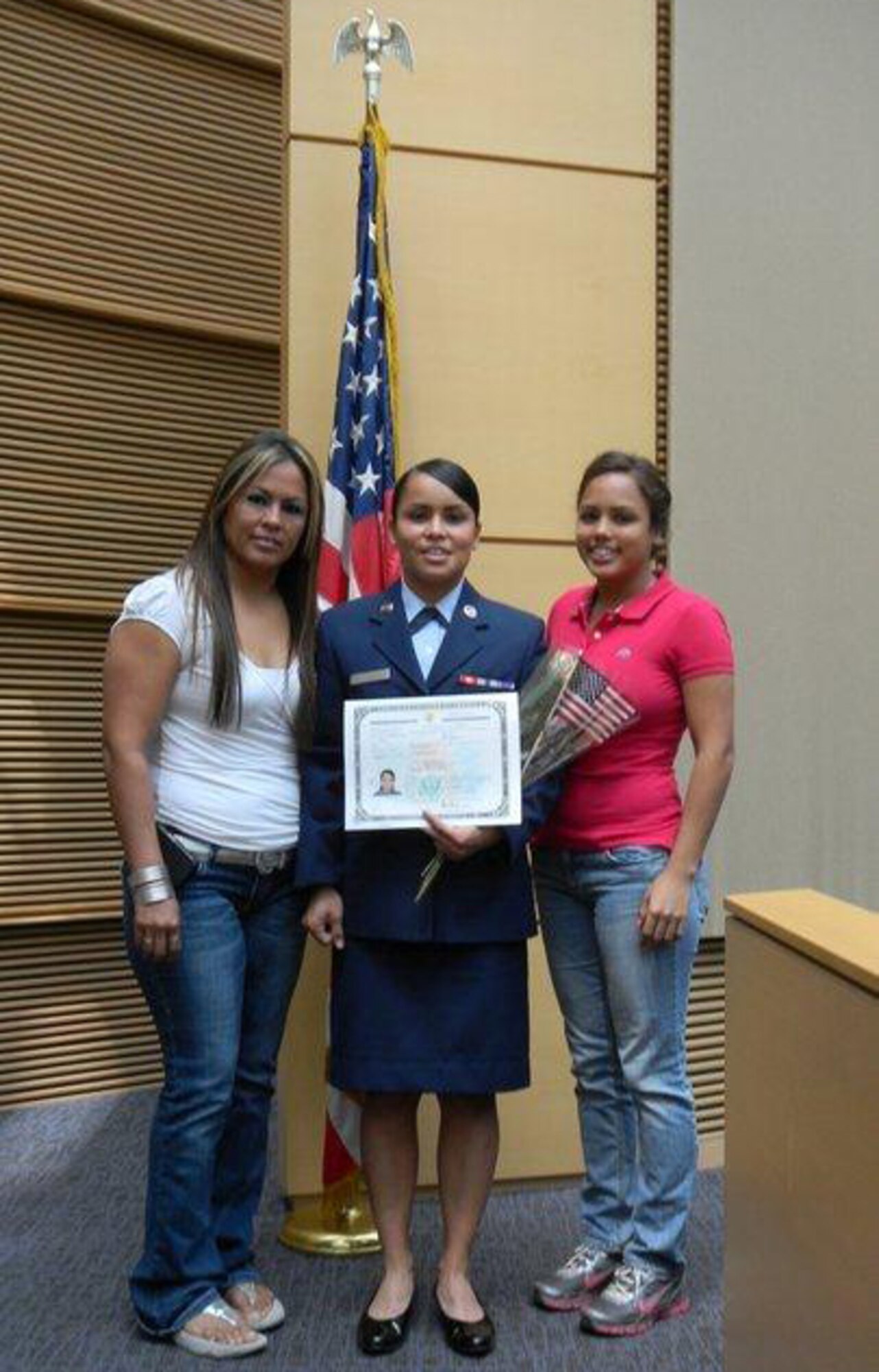 Airman 1st Class Perla Tapia Valenzuela, personnel specialist with the 920th Force Support Squadron detachment, stands with her aunt Ana Valenzuela(left) and sister Rosario Tapia(left) after she received her U.S. citizenship. Airman Tapia Valenzuela always dreamed of becoming a U.S. Citizen. (Courtesy photo)