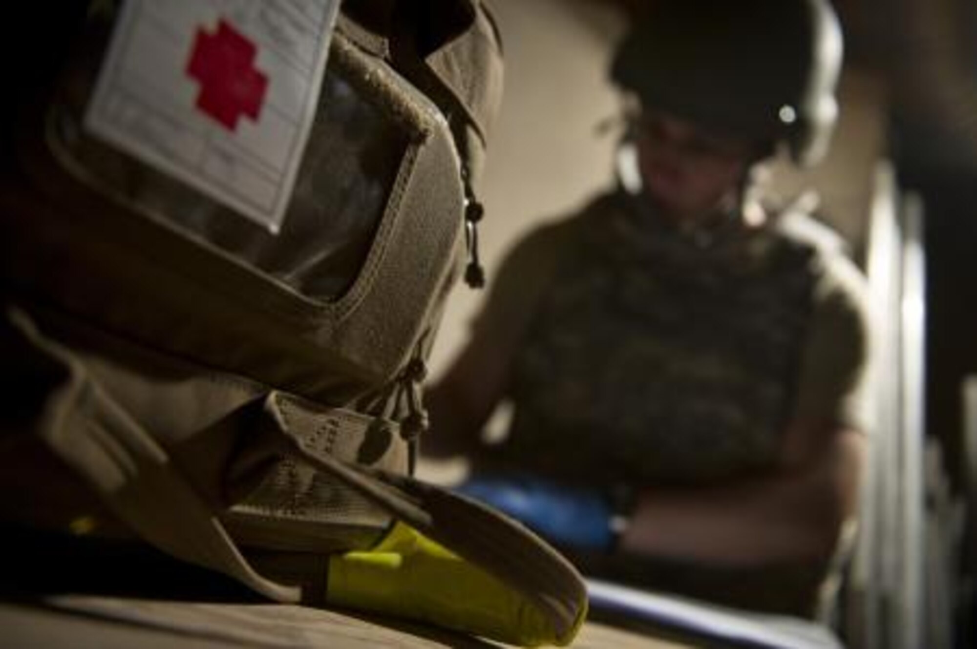 Airman 1st Class Dennis Nellessen, 451st Expeditionary Aeromedical Evacuation Squadron Detachment 1 Contingency Aeromedical Staging Facility aerospace medical technician, searches the bag of a wounded Marine for any potentially dangerous or contraband items during an anti-hijacking check prior to loading wounded Marines onto a C-130 Hercules at Camp Bastion, Afghanistan May 26, 2011. The CASF team is responsible for taking care of patients and transporting them from the staging facility and hospital to a waiting aircraft who are then taken to the next level of medical care. Airman Nellessen is deployed from the 633d Medical Operations Squadron, Joint Base Langley-Eustis, Va. (U.S. Air Force photo by Master Sgt. Adrian Cadiz/Released)