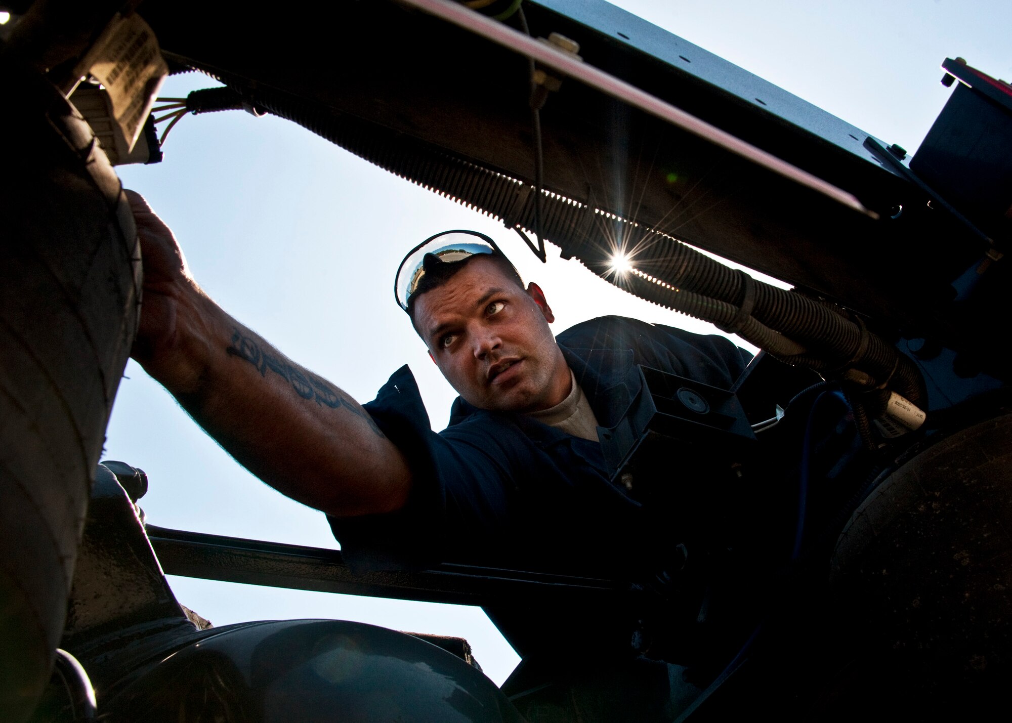 Staff Sgt. Russell Pinola, 96th Vehicle Management Flight, checks the seals on the back of a truck during an annual nuclear surety inspection of the vehicle.  Any vehicle that operates or moves weaponry is subject to a thorough serviceability inspection to ensure it meets all manufacturer specifications.  Nuclear sustainment is one of the top priorities of Air Force Materiel Command Commander, Gen. Donald Hoffman.   (U.S. Air Force photo/Samuel King Jr.)