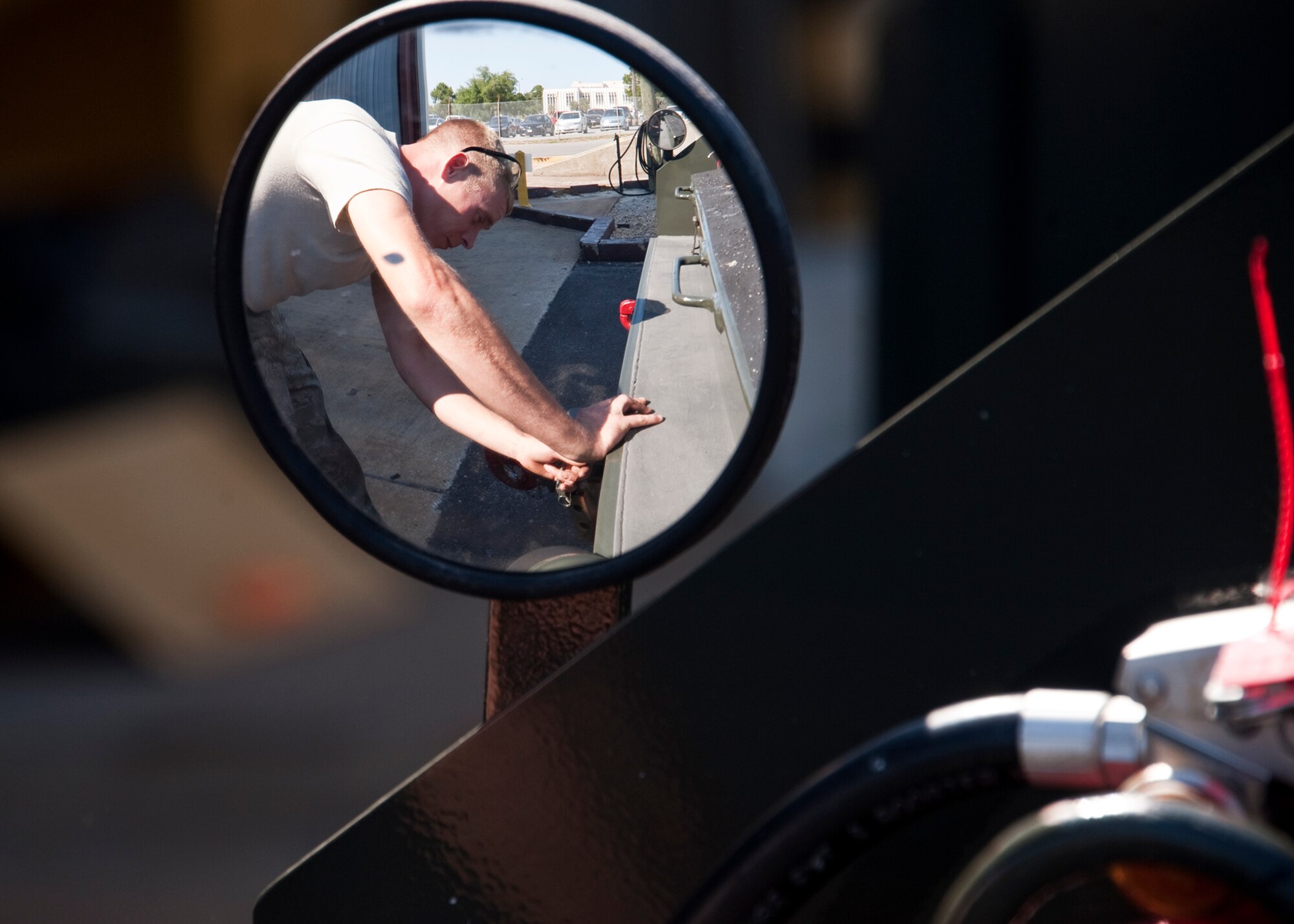Staff Sgt. Jebadiah James, 96th Vehicle Management Flight, checks to tow hitch on a flightline vehicle during an annual nuclear surety inspection.  Any vehicle that operates or moves weaponry is subject to a thorough serviceability inspection to ensure it meets all manufacturer specifications.  Nuclear sustainment is one of the top priorities of Air Force Materiel Command Commander, Gen. Donald Hoffman.   (U.S. Air Force photo/Samuel King Jr.)