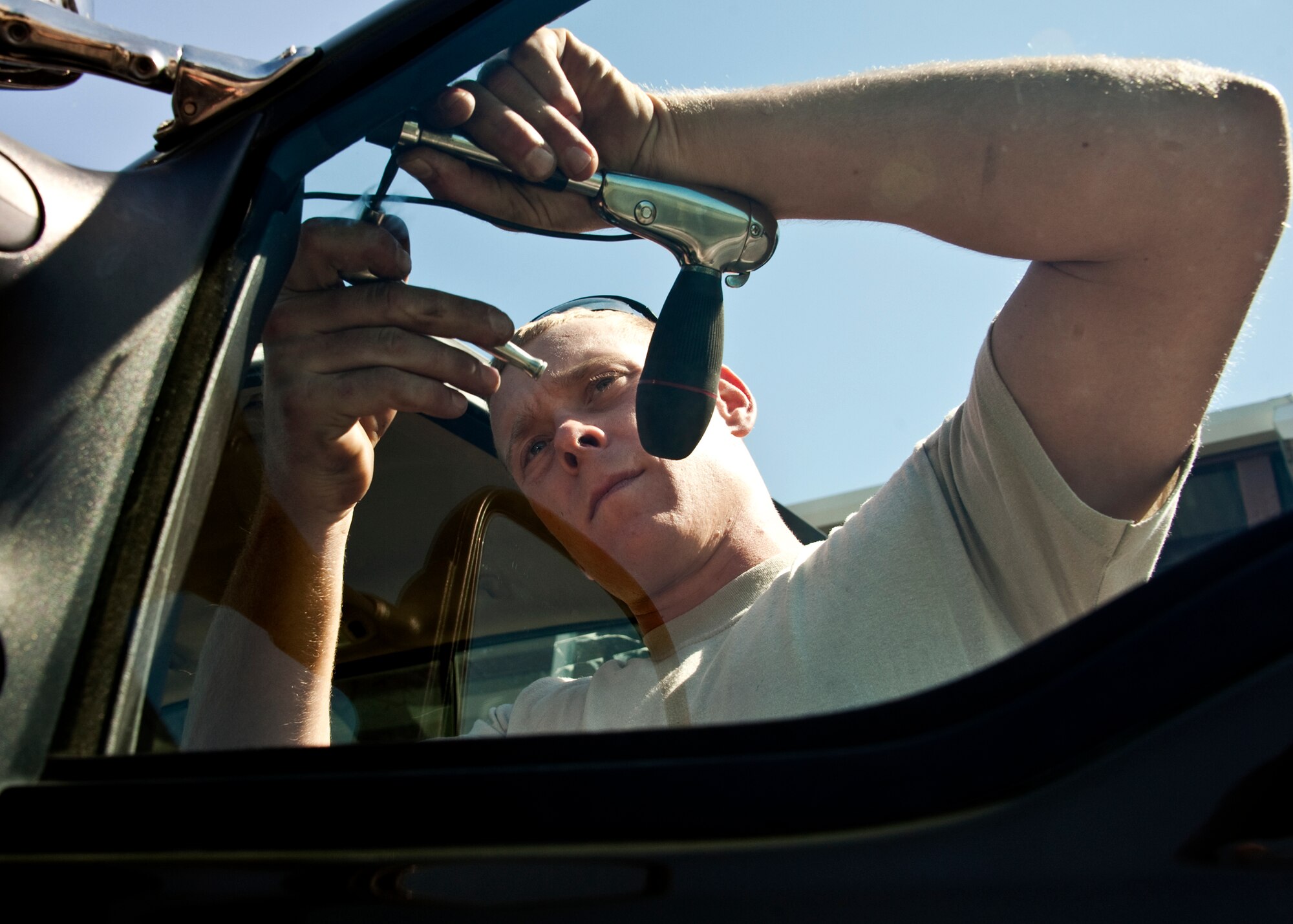 Staff Sgt. Jebadiah James, 96th Vehicle Management Flight, fixes an adjustable mirror on a flightline vehicle during an annual nuclear surety inspection.  Any vehicle that operates or moves weaponry is subject to a thorough serviceability inspection to ensure it meets all manufacturer specifications.  Nuclear sustainment is one of the top priorities of Air Force Materiel Command Commander, Gen. Donald Hoffman.   (U.S. Air Force photo/Samuel King Jr.)
