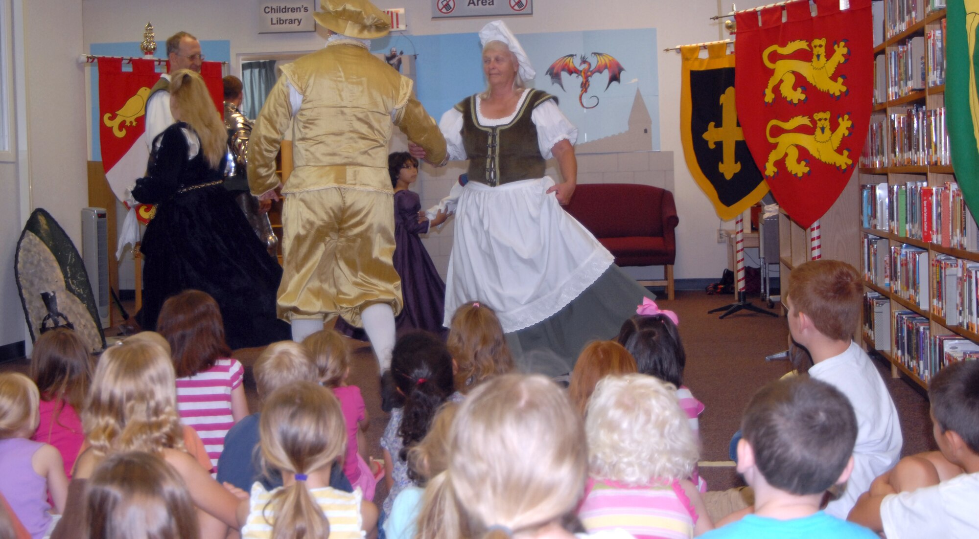 GOODFELLOW AIR FORCE BASE, Texas—Richard and Marsha Best, both members of the Angelo Renaissance Guild, demonstrate Renaissance  Era dancing for more than 40 Team Goodfellow children June 1st. The event is part of the 2011 Midsummer Knight’s Read, a free children’s summer reading program.  For more information contact the base library at (325) 654-3232. (U.S. Air Force photo/Airman 1st Class Jessica Keith)