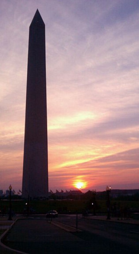 The sun sets behind the Washington Monument in Washington, D.C. June 5.