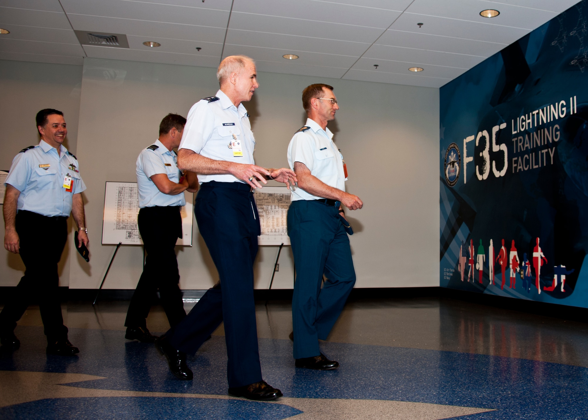 Maj. Gen. Rick Devereaux, U.S. National Director for Air Space Interoperability Council, and other council members begin their tour of the Joint Strike Fighter academic training center June 6 at Eglin Air Force Base, Fla.  ASIC is an assembly of leaders from the air forces of Australia, Canada, New Zealand, the United Kingdom and the United States.  The objective of the group is to ensure member nations are able to integrate seamlessly in joint and combined operations.  Eglin played host to the ASIC members for their annual national directors meeting.  (U.S. Air Force photo/Samuel King Jr.)