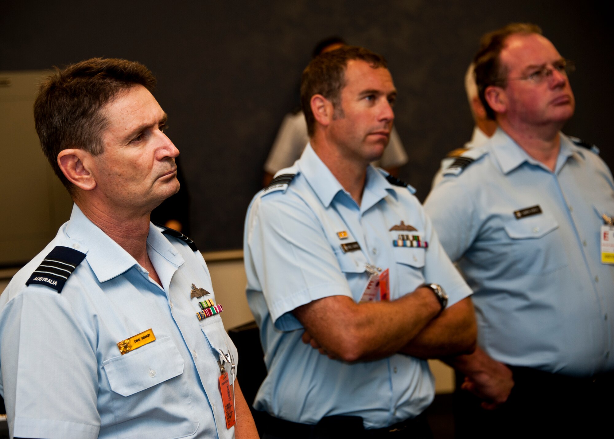 Air Space Interoperability Council members watch a maintenance training simulation during their tour of the Joint Strike Fighter academic training center June 6 at Eglin Air Force Base, Fla.  ASIC is an assembly of leaders from the air forces of Australia, Canada, New Zealand, the United Kingdom and the United States.  The objective of the group is to ensure member nations are able to integrate seamlessly in joint and combined operations.  Eglin played host to the ASIC members for their annual national directors meeting.  (U.S. Air Force photo/Samuel King Jr.)