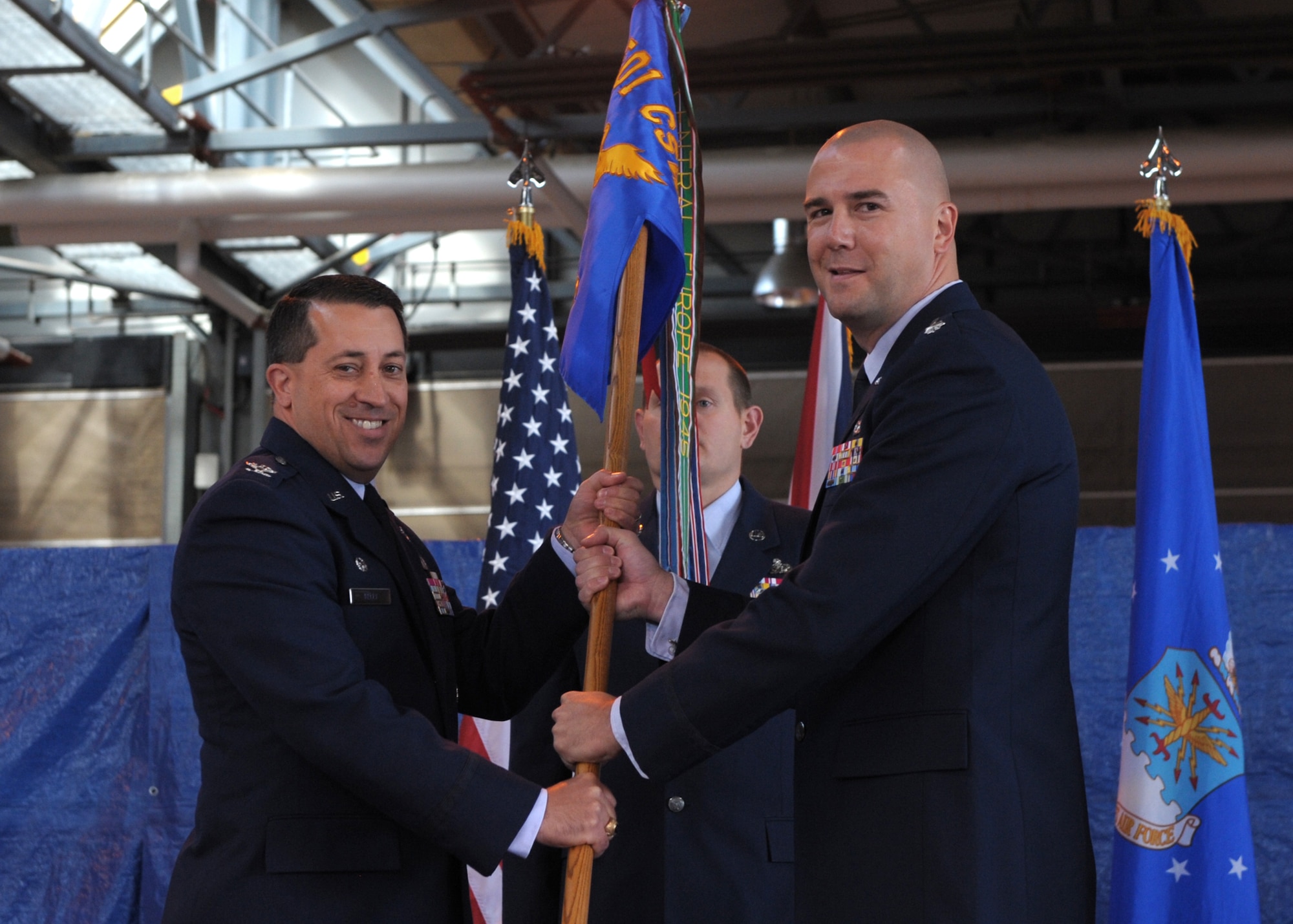 RAF ALCONBURY, United Kingdom - Col. Brian Kelly, 501st Combat Support Wing commander, gives command of the 423rd Air Base Group to Lt. Col. Michael Reiner here June 7. Lt. Col. Reiner is responsible for providing the full range of operational, logistical, medical, communications support, and community services to more than 6,000 military and civilian personnel and their families at RAF Alconbury, RAF Molesworth, RAF Upwood and the  426th Air Base Squadron at Stavanger, Norway. He also serves as host to 11 multi-service and multi-national tenant units. 