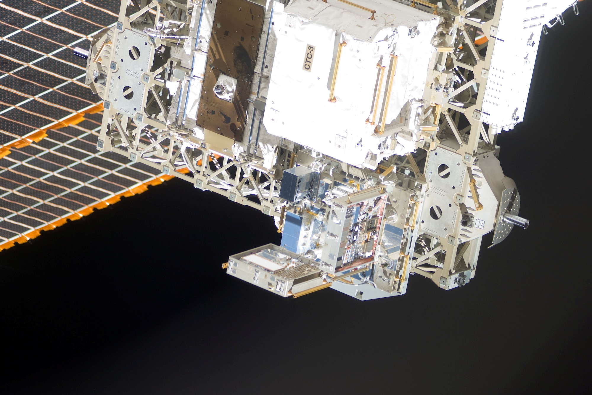 The Materials International Space Station Experiment or MISSE is observed outside the shuttle orbiter Discovery during the STS-133 mission in March 2011. Air Force Research Laboratory scientists completed the seventh in a series of materials-related experiments June 1, 2011 when the experiments returned to earth after 18 months in space. (NASA Photo)