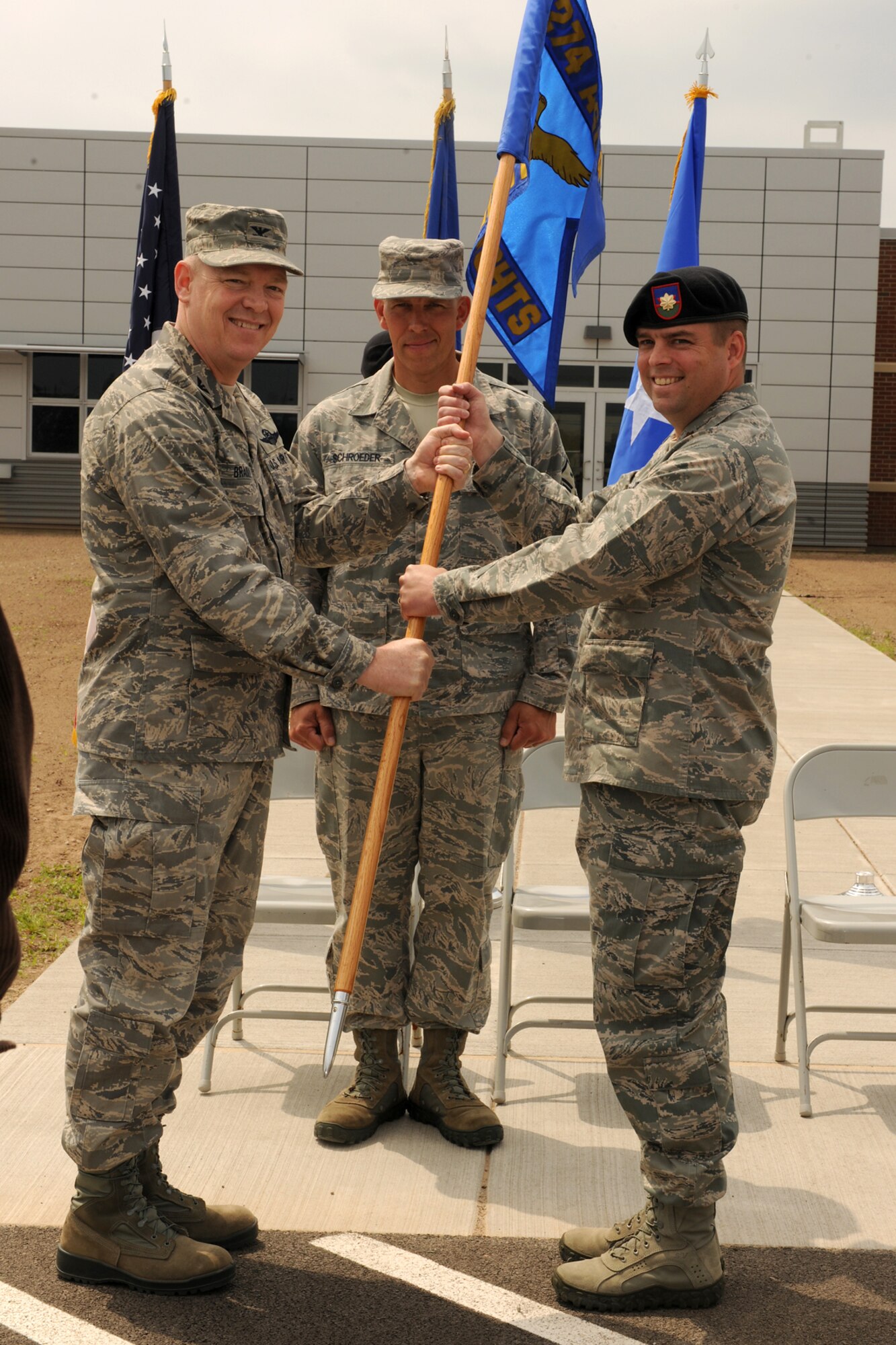 U.S. Air Force Maj. Patrick Cox accepts the 274th Air Support Operations Squadron (ASOS) flag from Col. Kevin Bradley during a change of command ceremony held on June 5, 2011 at Hancock Field Air National Guard Base, Syracuse, NY.  Maj. Cox assumed commander of the 274 ASOS from Lt. Col. Alberto Gaston. 