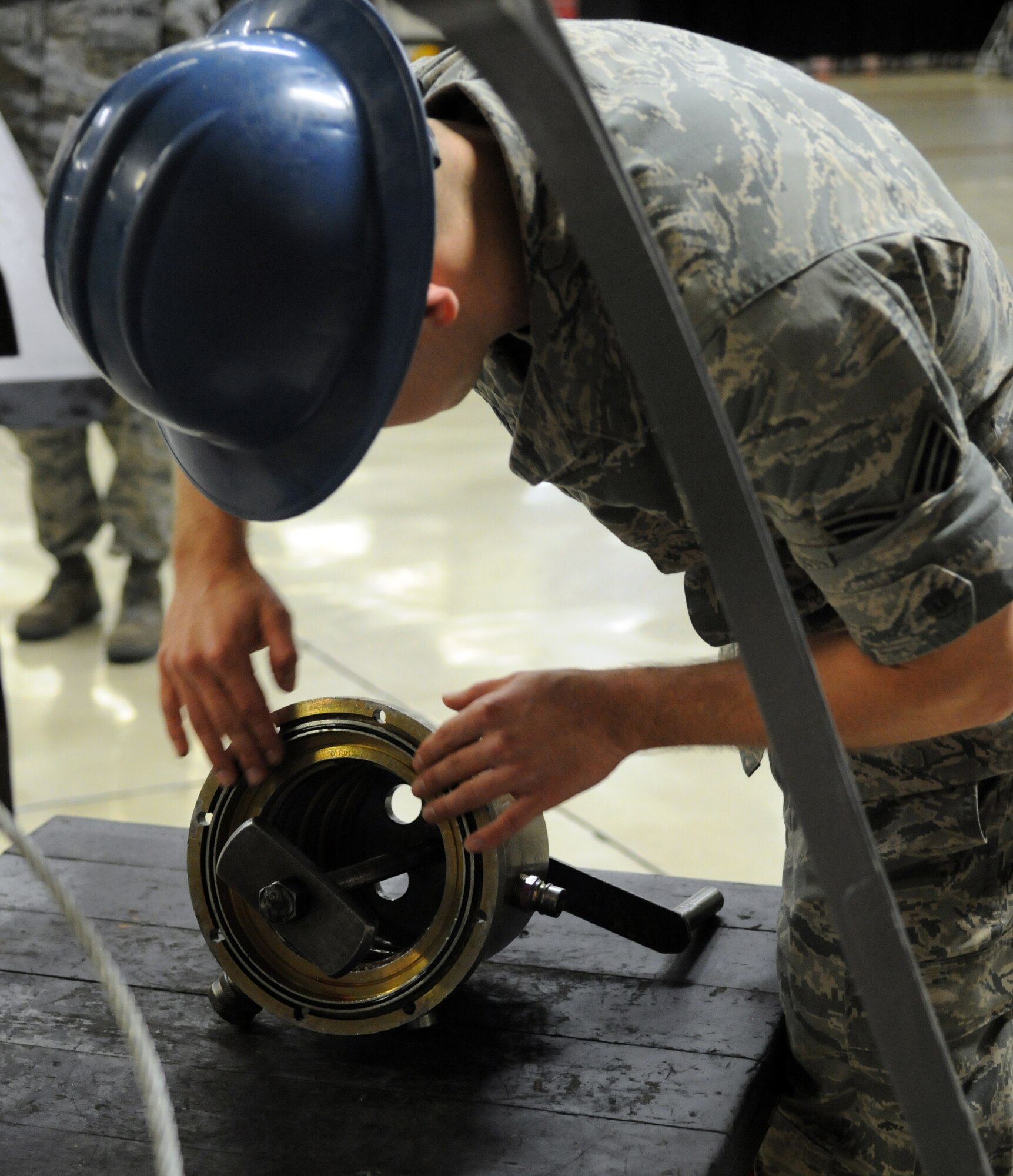 YOKOTA AIR BASE, Japan -- Senior Airman Charles Guisasola, 374th Maintenance Squadron Propulsion Flight aerospace propulsion craftsman, prepares a post-test adapter during an Initial Readiness Response Exercise, (IRRE), at Yokota, June 7, 2011. The goal of the exercise is to evaluate Yokota's ability to respond rapidly and effectively to real world disasters. (U.S. Air Force photo/Airman 1st Class Krystal M. Garrett) 