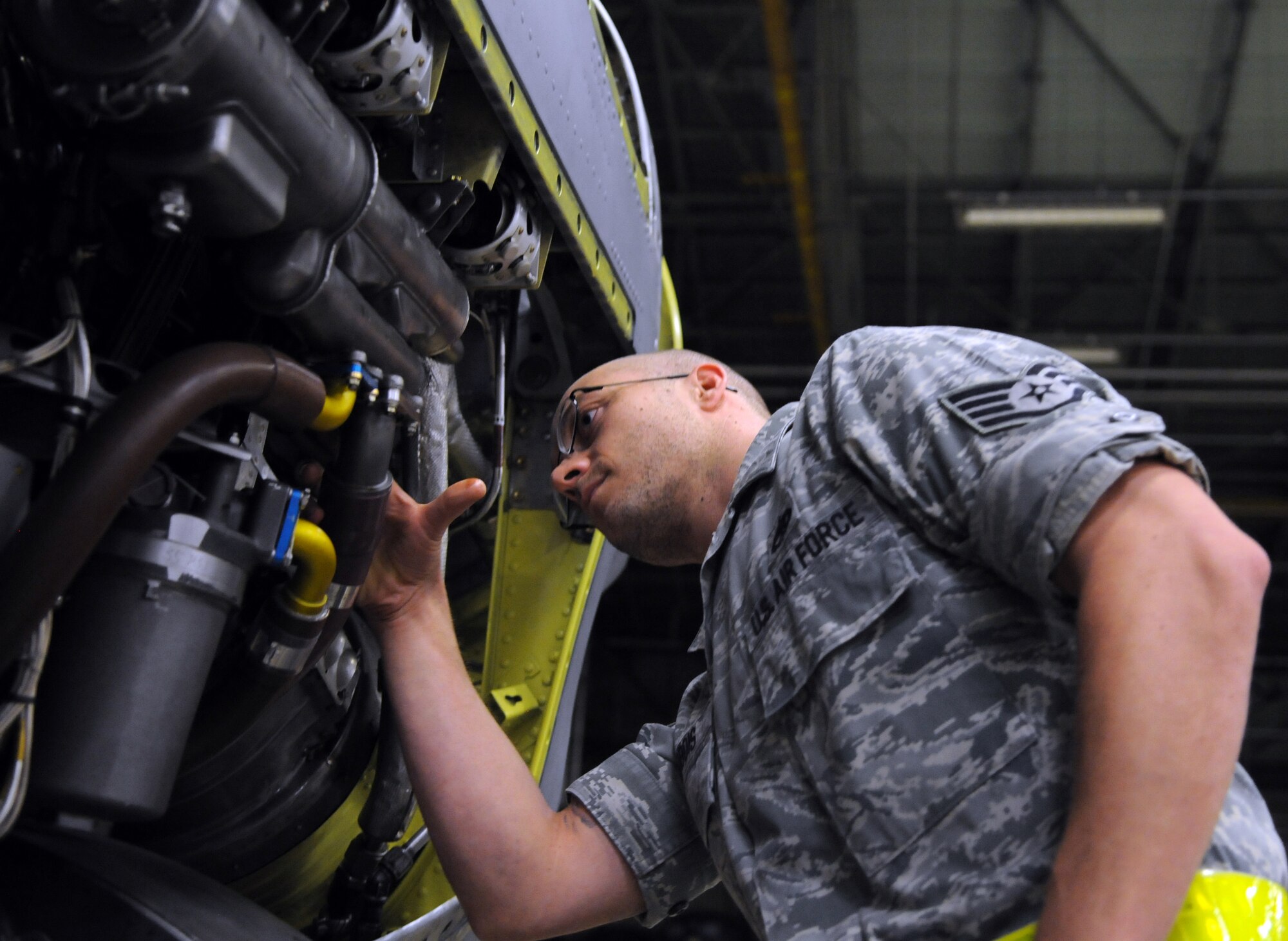 YOKOTA AIR BASE, Japan -- Staff Sgt. Nathan Gadbois, 374th Maintenance Squadron Propulsion Flight aerospace propulsion craftsman, inspects a C-130 Hercules engine during an Initial Readiness Response Exercise at Yokota Air Base, Japan, June 7, 2011. Sergeant Gadbois ensures engines are working properly for C-130 Hercules to fly. (U.S. Air Force photo/Airman 1st Class Krystal M. Garrett) 
