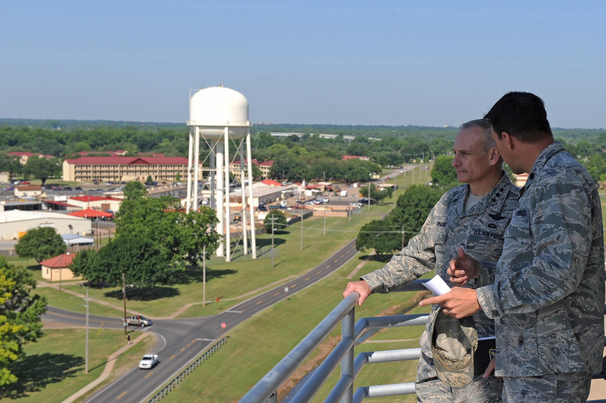 Lt. Col. David Chisenhall, 2nd Mission Support Group deputy commander, escorts Lt. Gen. James Kowalski, Air Force Global Strike Command commander, around the air traffic control tower catwalk at Barksdale Air Force Base, La., May 17. Colonel Chisenhall explained how ongoing military construction projects at Barksdale have improved Airman morale and welfare. (U.S. Air Force photo/Airman 1st Class Micaiah Anthony)(RELEASED)