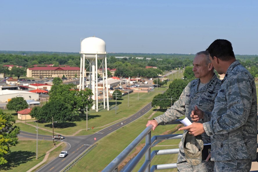 Lt. Col. David Chisenhall, 2nd Mission Support Group deputy commander, escorts Lt. Gen. Jim Kowalski, Air Force Global Strike Command commander, around the air traffic control tower catwalk at Barksdale Air Force Base, La., May 17. Colonel Chisenhall explained how ongoing military construction projects at Barksdale have improved Airman morale and welfare. (U.S. Air Force photo/Airman 1st Class Micaiah Anthony)(RELEASED) 