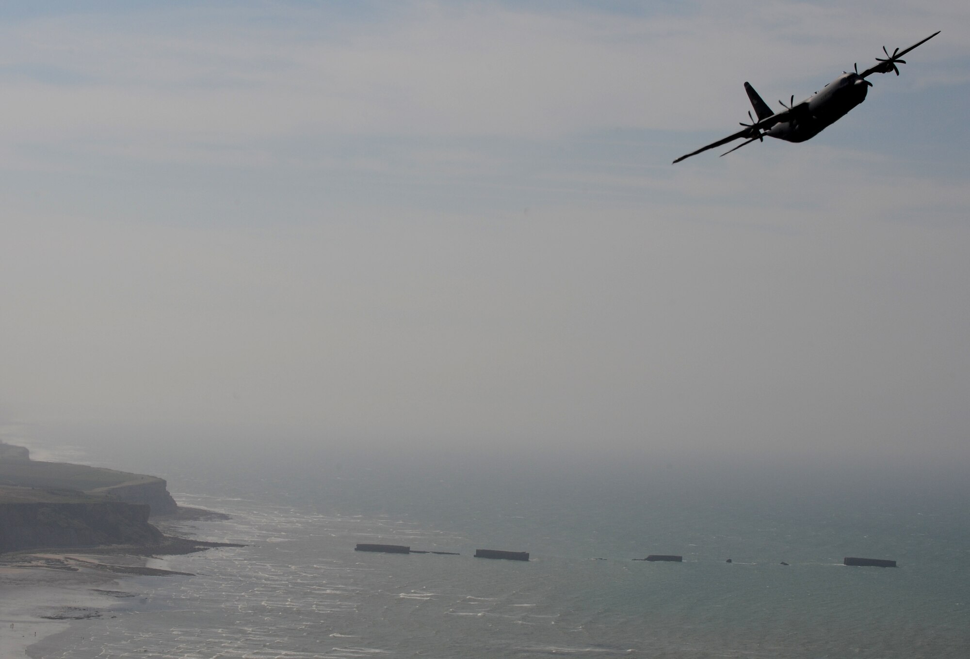 A U.S. Air Force C-130J Super Hercules from the 37th Airlift Squadron, Ramstein Air Base, Germany, flies above the beaches of Normandy, France for the 67th Anniversary of D-Day, June 3, 2011. Each year since the liberation of Normandy, U.S. forces along with allied nations come together to honor those who gave the ultimate sacrifice on that day. This year's ceremony is scheduled to be attended by dozens of American World War II veterans. (U.S. Air Force photo by Senior Airman Caleb Pierce)