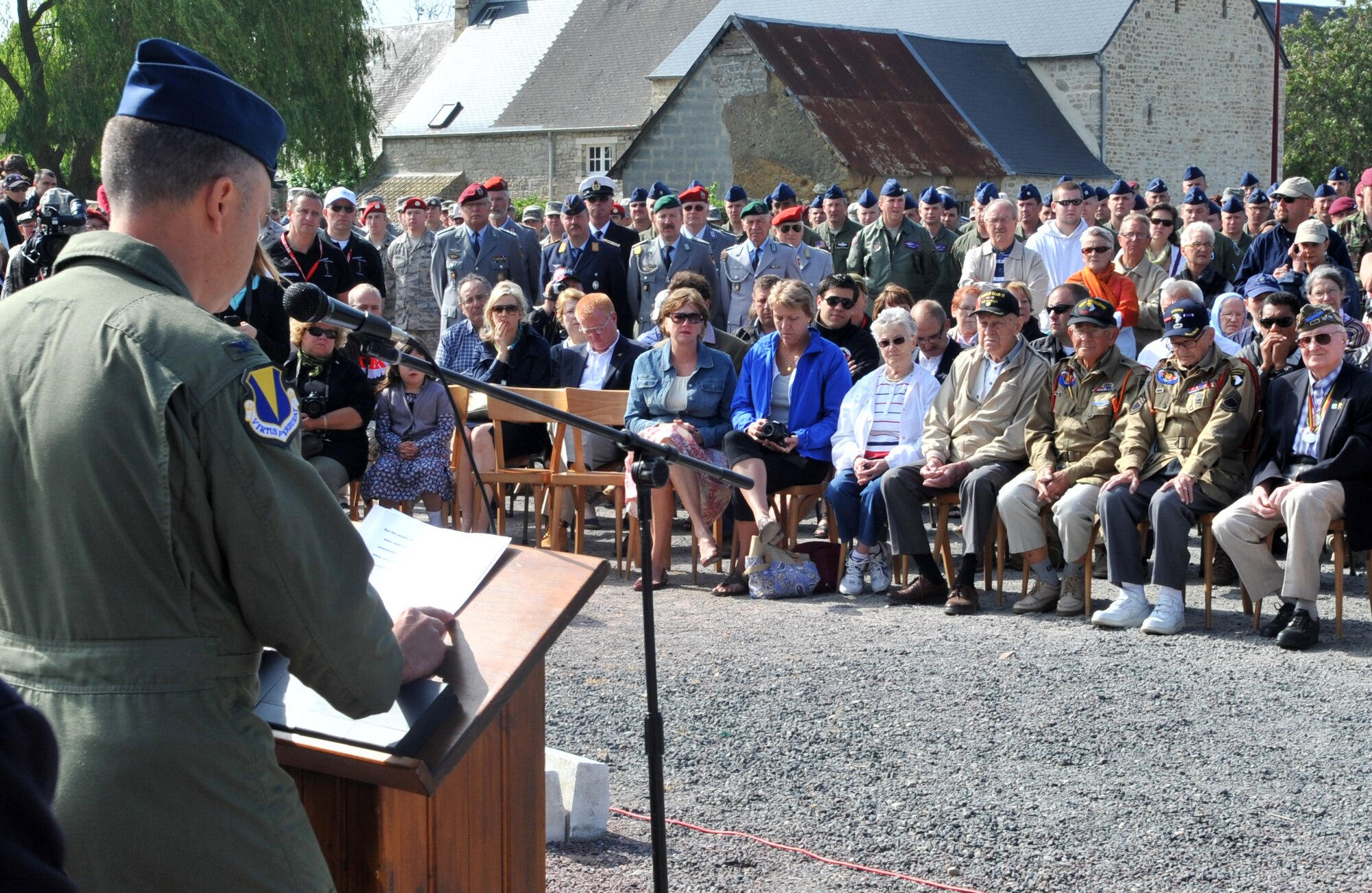 U.S. Air Force Col. Stephen Lambert, 86th Airlift Wing vice commander, speaks with to those in attendance at a ceremony in Picauville, France for the 67th Anniversary of D-Day, June 3, 2011. Each year since the liberation of Normandy, U.S. forces along with allied nations come together to honor those who gave the ultimate sacrifice on that day. This year's ceremony is scheduled to be attended by dozens of American World War II veterans. (U.S. Air Force photo by Senior Airman Caleb Pierce) 