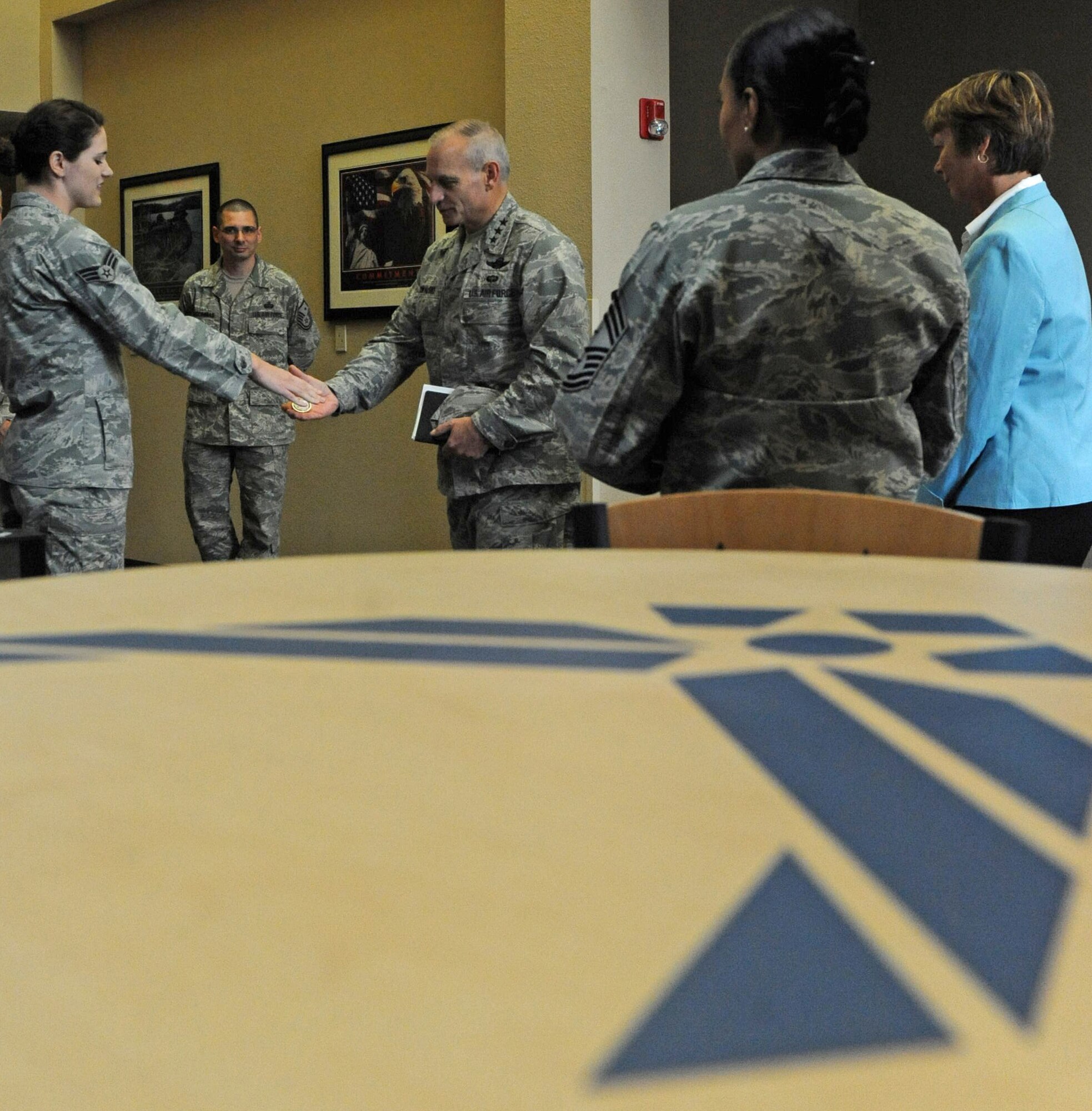 Lt. Gen. James Kowalski, Air Force Global Strike Command commander, presents a coin to Senior Airman Jennifer Coffin, president of the Barksdale Chapter of Airman Against Drunk Driving, at Barksdale Air Force Base, La., May 19. Airman Coffin briefed General Kowalski about the AADD program and future plans to improve the program. (U.S. Air Force photo/Airman 1st Class Micaiah Anthony)(RELEASED)