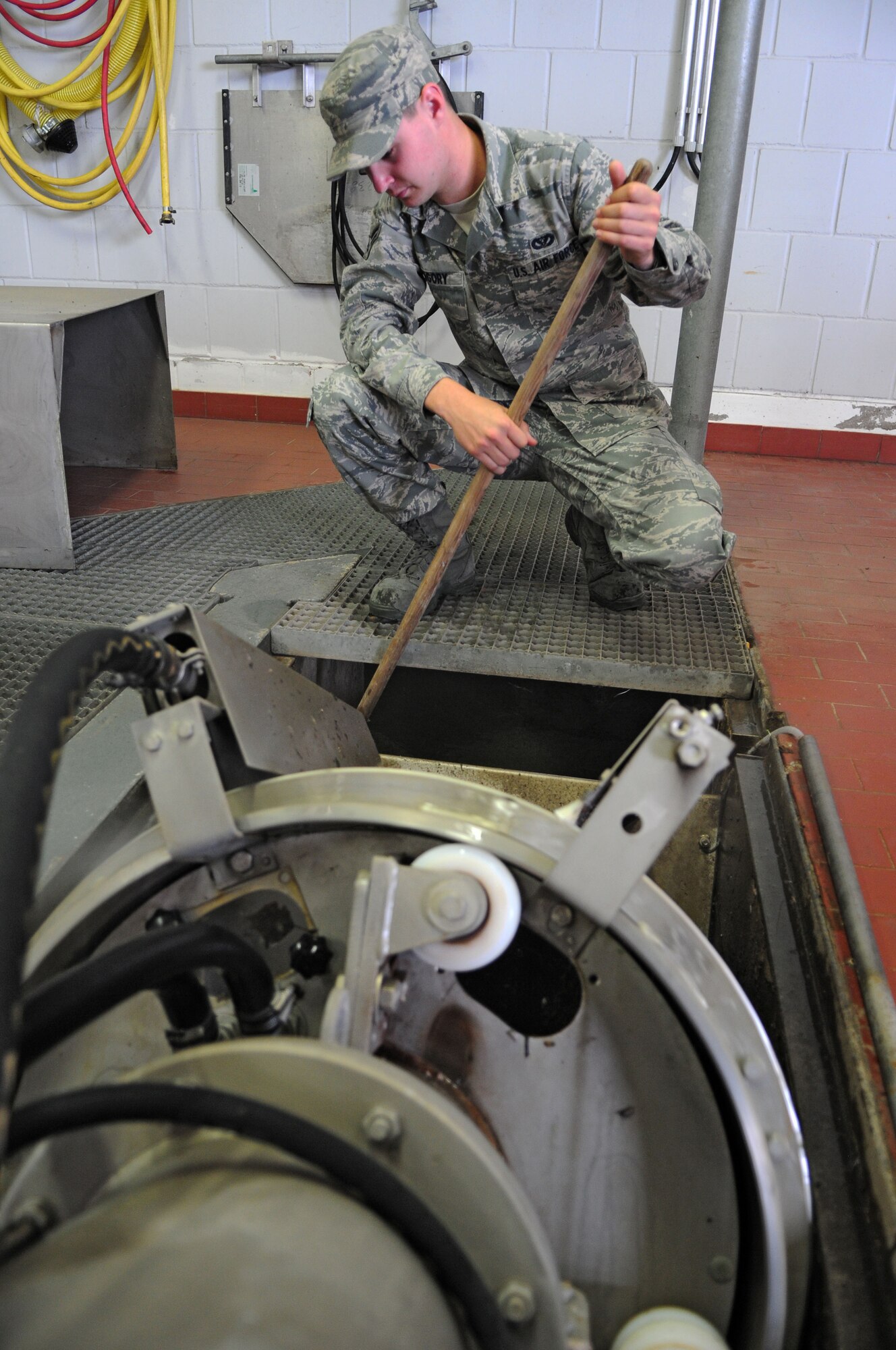 SPANGDAHLEM AIR BASE, Germany – Airman 1st Class David Gregory, 52nd Civil Engineer Squadron water and fuel systems maintenance apprentice, cleans debris from a filter at the water treatment facility here June 6. The facility processes wastewater from the base to remove hazardous chemicals before it is released back into the environment. (U.S. Air Force photo/Airman 1st Class Matthew B. Fredericks)
