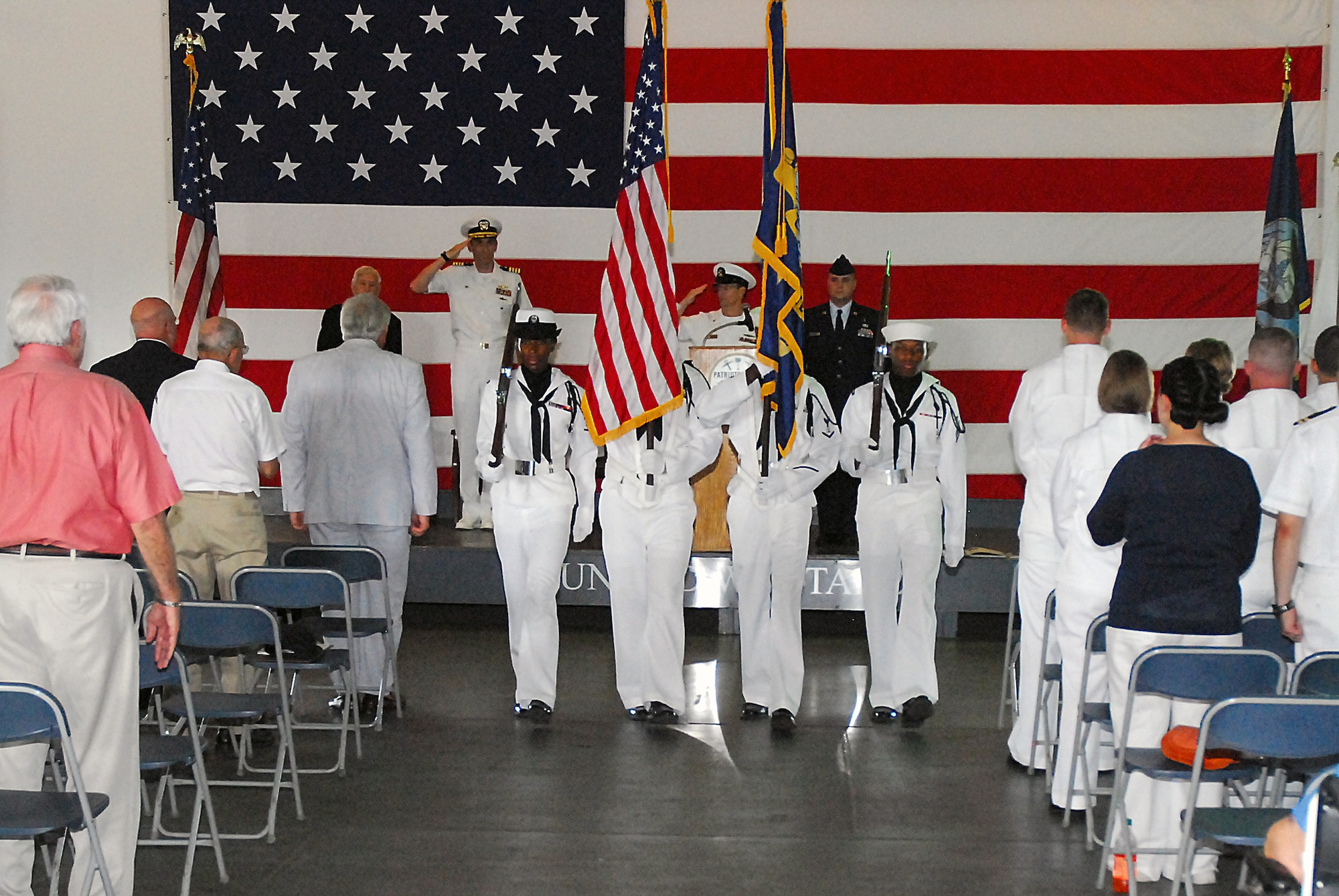 Hospital Corpsman 3rd Class Tia Doss, left, Mineman 2nd Class Anthony Cole, Culinary Specialist 3rd Class Christopher Dennis, and Hospitalman Jeffery Prescott present the Colors during the 69th Anniversary of the Battle of Midway Commemoration ceremony onboard the USS Yorktown (CV 10) at Patriots Point Naval and Maritime Museum, June 3. The Battle of Midway was a pivotal turning point during World War II in the Pacific. (U.S. Navy photo/ Machinist's Mate 3rd Class Brannon Deugan)