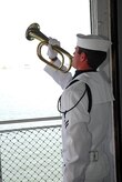 Master-at-Arms 2nd Class Chase Ferguson plays Taps during the wreath laying ceremony at the 69th Anniversary of the Battle of Midway commemoration ceremony onboard the USS Yorktown (CV 10) at Patriots Point Naval and Maritime Museum, June 3. MA2 Ferguson is assigned to Naval Operational Support Command, Joint Base Charleston. (U.S. Navy photo/Machinist's Mate 3rd Class Brannon Deugan) 

