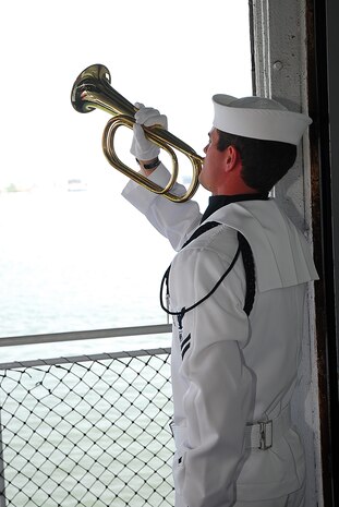Master-at-Arms 2nd Class Chase Ferguson plays Taps during the wreath laying ceremony at the 69th Anniversary of the Battle of Midway Commemoration onboard the USS Yorktown (CV 10) at Patriots Point Naval and Maritime Museum, June 3. MA2 Ferguson is assigned to Naval Support Activity, Joint Base Charleston. (U.S. Navy photo/Machinist's Mate 3rd Class Brannon Deugan)