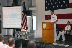 Capt. Ralph Ward delivers the keynote speech for the 69th Anniversary of the Battle of Midway Commemoration ceremony onboard the USS Yorktown (CV 10) located at Patriots Point Naval and Maritime Museum, June 3. Captain Ward provided a historical timeline of the events that took place at the Battle of Midway and discussed the significance of the victory in the Pacific. Captain Ward is the Joint Base Charleston deputy commander (U.S. Navy photo/Machinist's Mate 3rd Class Brannon Deugan)
