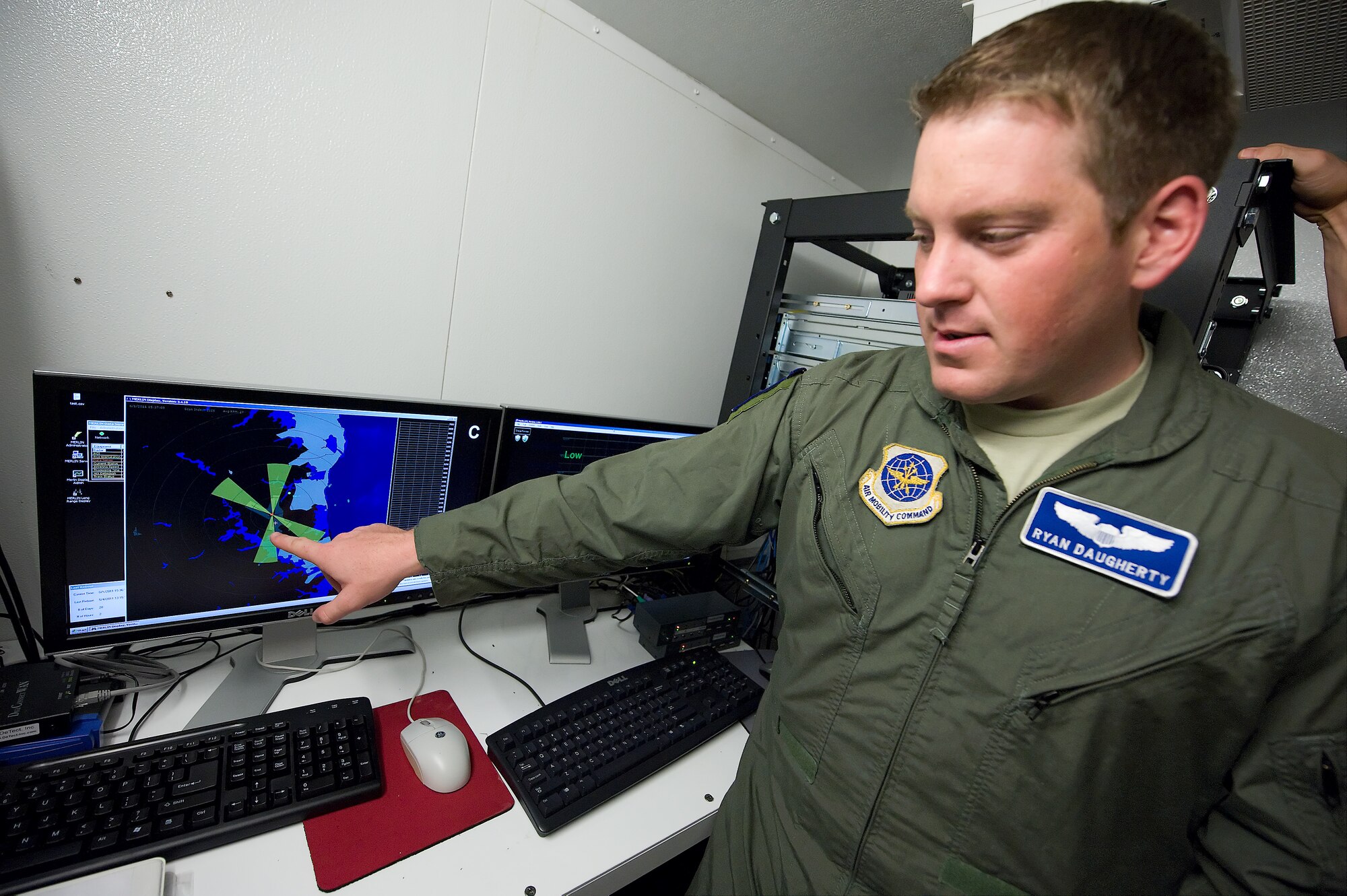 Captain Ryan Daugherty, 436th Airlift Wing Safety flight safety officer, explains how radar actively reduces bird strikes June 1, 2011 at Dover Air Force Base, Del. (U.S. Air Force photo by Steve Kotecki)
