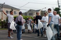 MIZUHO TOWN, Japan -- Master Sgt. Paul Crisostomo, 374th Maintenance Group Mizuho town clean-up coordinator, directs Airmen as they begin thier search for litter. The group of roughly 70 volunteers from the 374th Maintenance Group joined residents of Mizuho, a small town neighboring Yokota Air Base, Japan, in the town's 29th annual clean up day, June 5, 2011. (U.S. Air Force photo/Captain Raymond Geoffroy)
