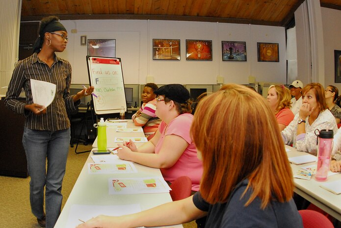 Fay McFadden, a Fleet and Family Service Center volunteer, teaches Couponing 101 at FFSC on Joint Base Charleston-Weapons Station, May 18. Mrs. McFadden, a military spouse and a mother of six children has successfully cut her grocery budget from $1,400 a month to less than $300 a month with effective couponing and shares her couponing knowledge in an effort to educate other military spouses on how to manage their own budgets. (U.S. Navy photo/ Machinist's Mate 3rd Class Brannon Deugan)