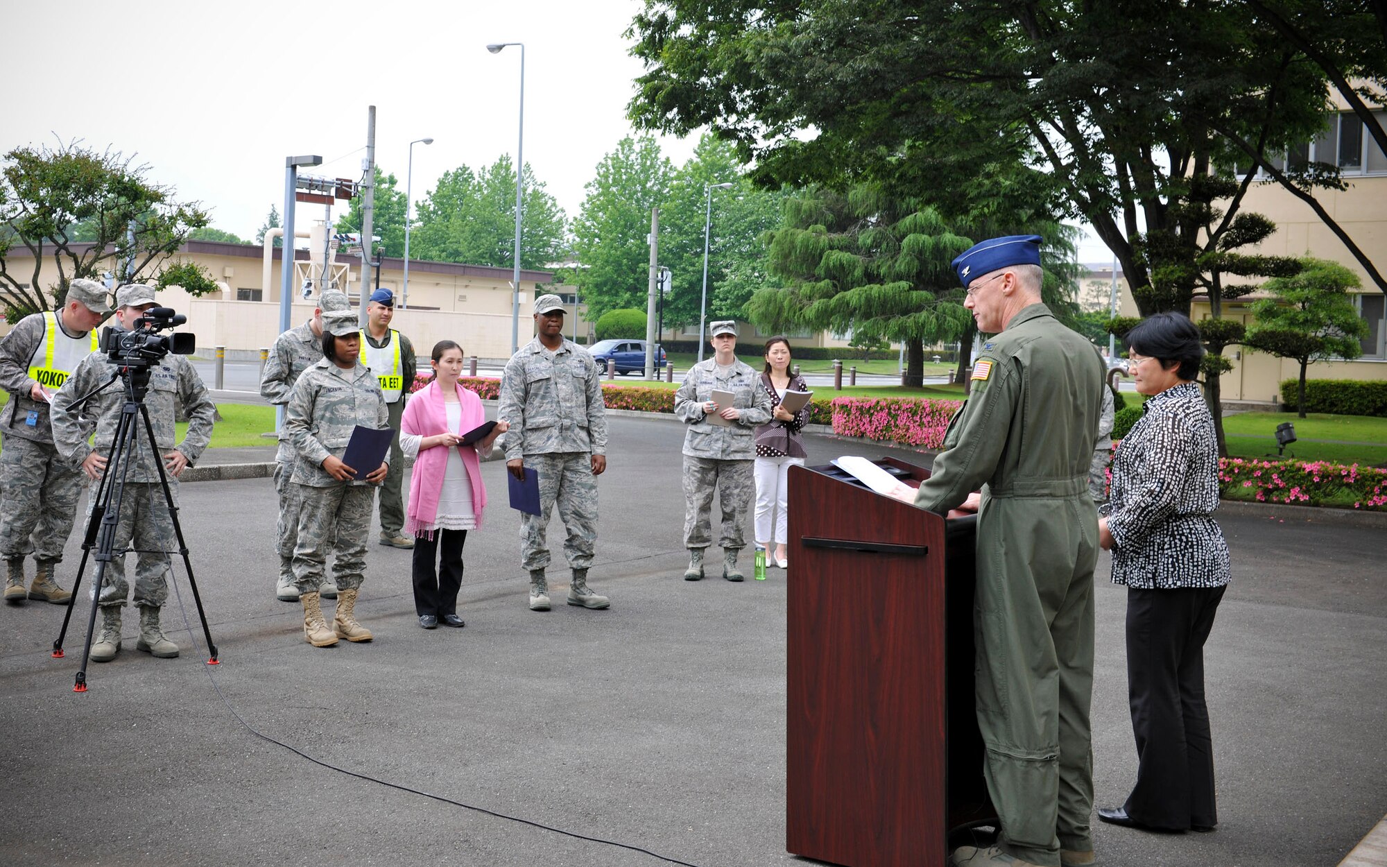 YOKOTA AIR BASE, Japan -- Col. Otto Feather, 374th Airlift Wing commander, answers questions from media during a mock press conference during an Initial Readiness Response Exercise at Yokota Air Base, Japan, June 7, 2011. Simulated press conferences give wing leadership an opportunity to practice interaction with media. (U.S. Air Force photo/Senior Airman Andrea Salazar)