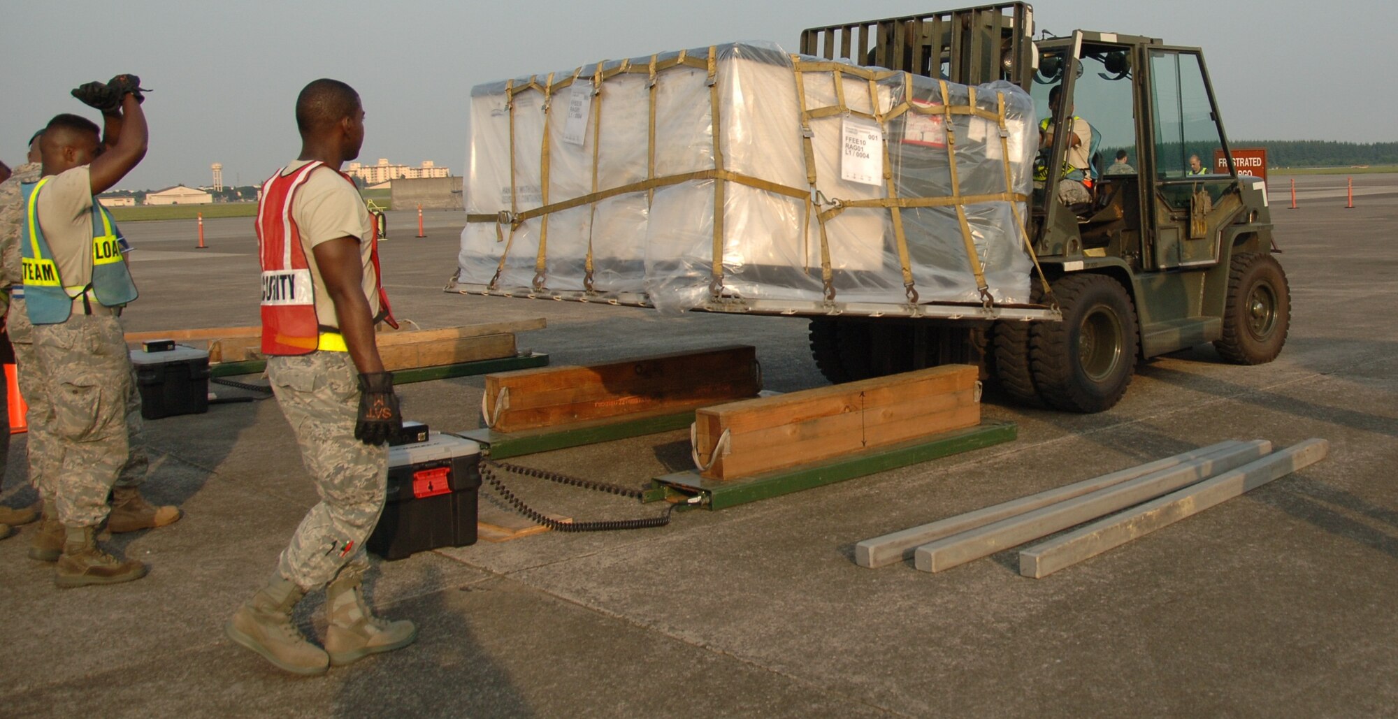 YOKOTA AIR BASE, Japan -- Senior Airman Darnell Strawder, 374th Maintenance Squadron, places cargo on a scale during an Initial Readiness Response Exercise at Yokota Air Base, Japan, June 7, 2011. The goal of the exercise is to test Yokota's ability to respond appropriately and effectively to real world disasters. (U.S. Air Force photo/Airman 1st Class Lynsie Nichols) 