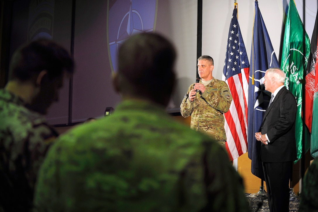 U.S. Army Lt. Gen. David M. Rodriguez, commander, International Security Assistance Force Joint Command, introduces U.S. Defense Secretary Robert M. Gates to International Joint Commission personnel at the Joint Operations Center in Kabul, Afghanistan, June 7, 2011.
