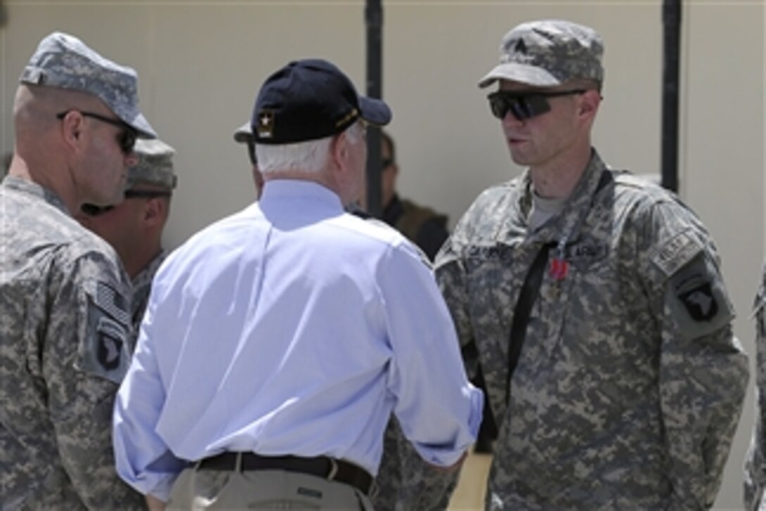 Secretary of Defense Robert M. Gates presents 17 medals to the soldiers of Task Force Currahee before thanking them for their service and bidding them farewell at a Forward Operating Base in Afghanistan on June 6, 2011.  