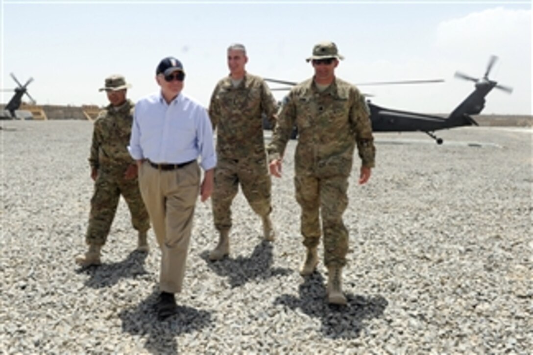 Secretary of Defense Robert M. Gates and Lt. Gen. David Rodriguez (2nd from right) are greeted by soldiers from Task Force Ramrod at a Forward Operating Base in Afghanistan on June 6, 2011.  