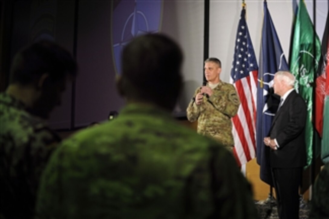 Commander of International Security Assistance Force Joint Command Lt. Gen. David M. Rodriguez introduces Secretary of Defense Robert M. Gates to IJC personnel at the Joint Operations Center in Kabul, Afghanistan, on June 7, 2011.  